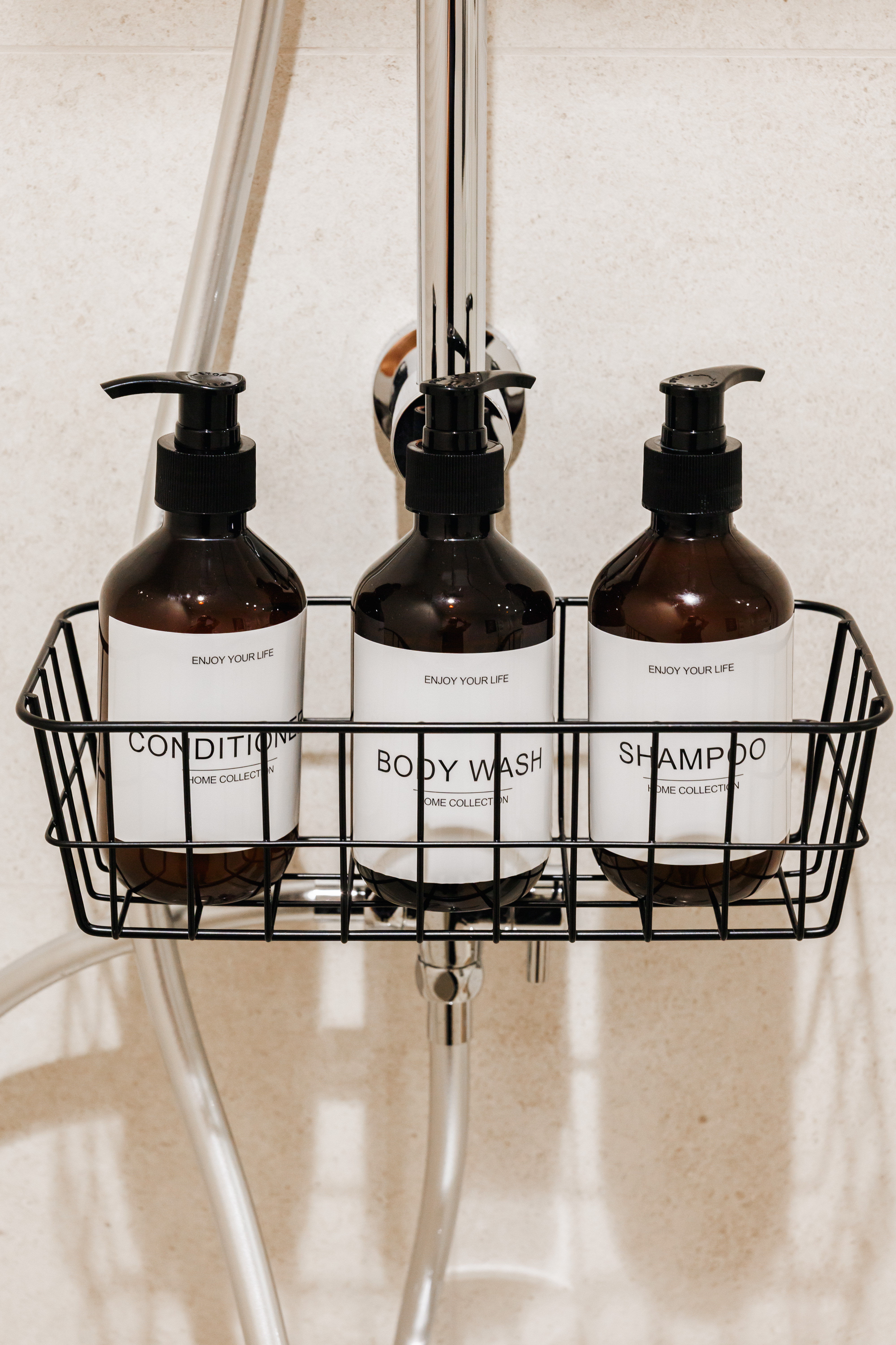 Hotel-style shower amenities with shampoo, conditioner, and body wash