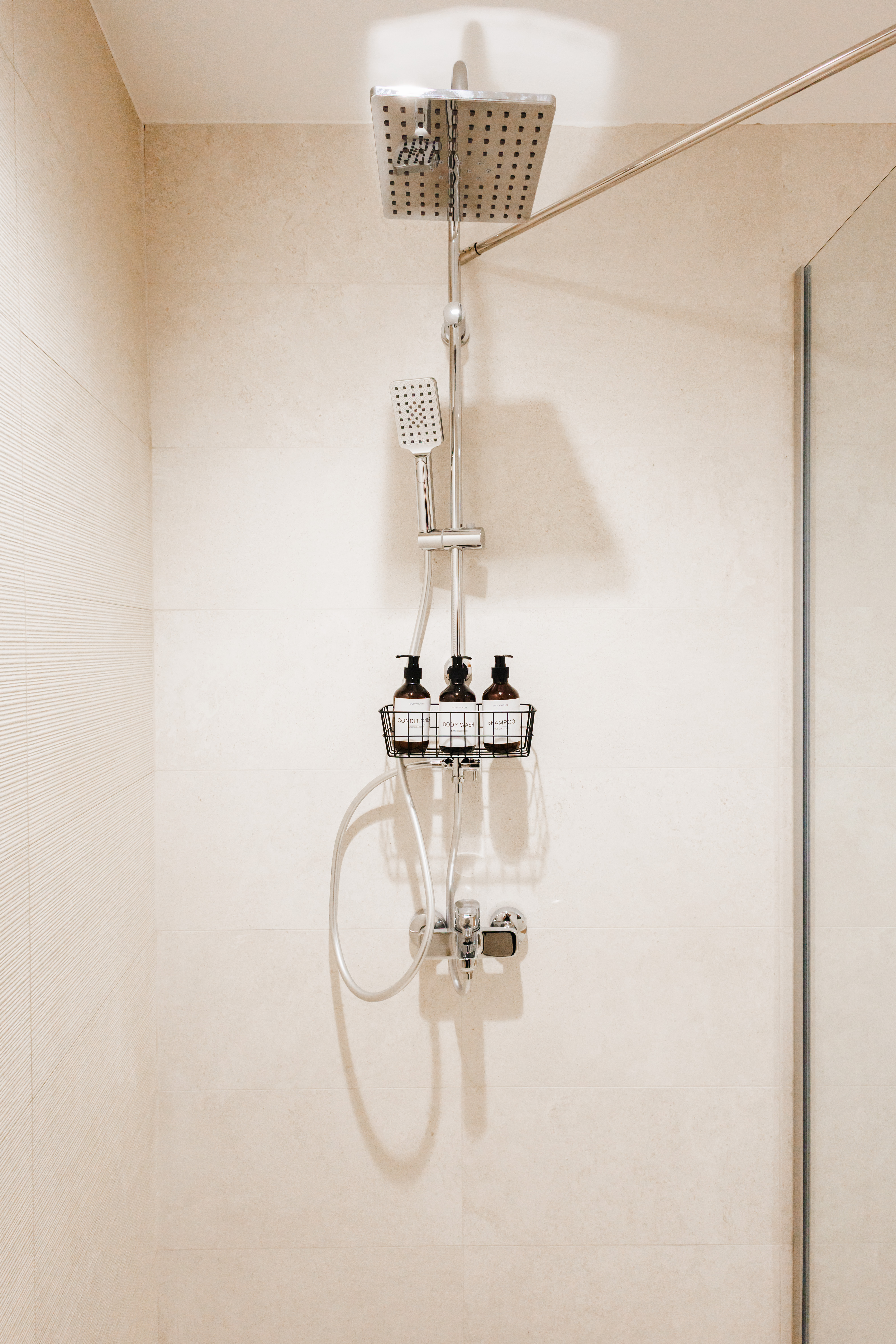 Spa-style walk-in shower with rainfall head and sleek modern finishes