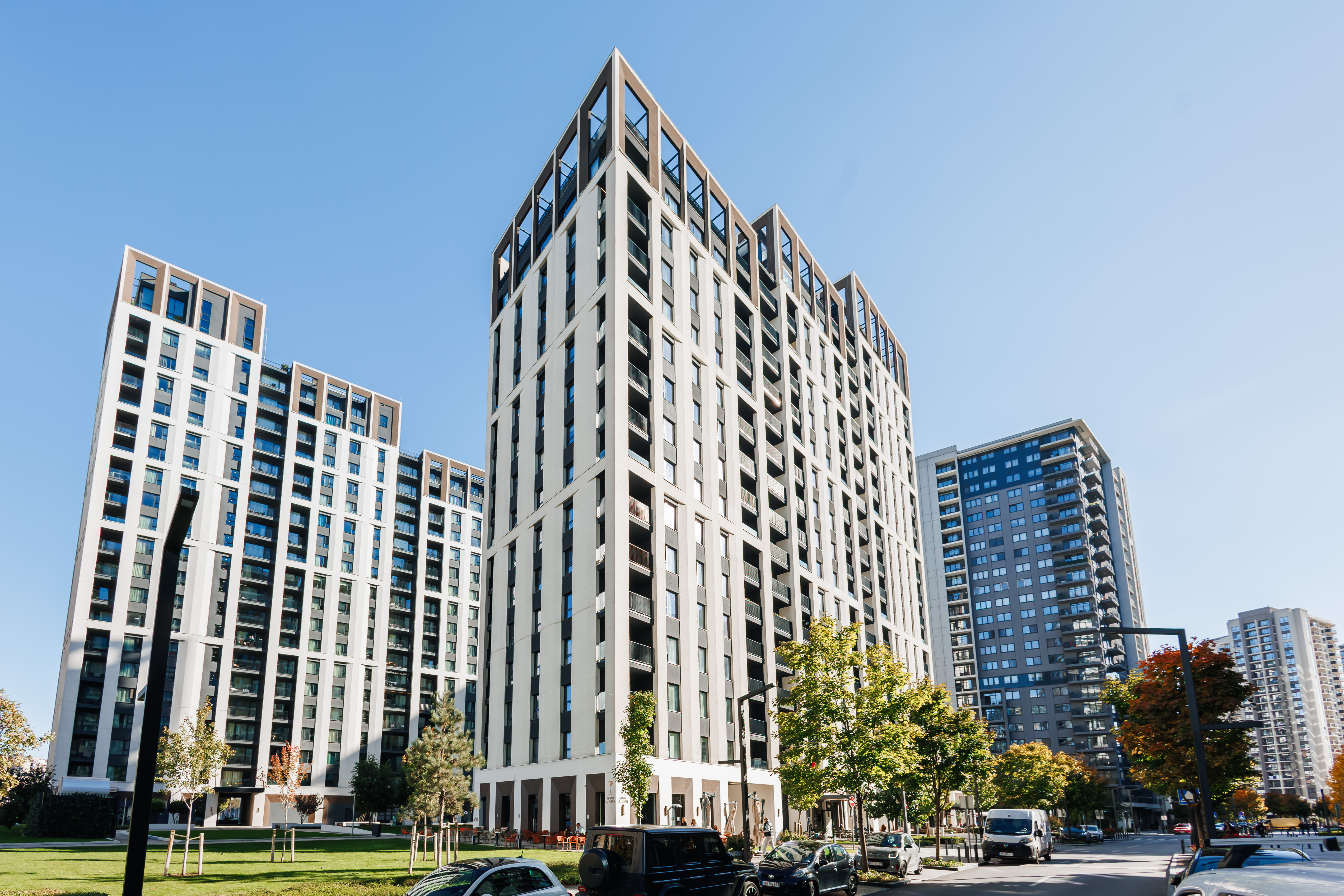 Modern high-rise stay with sleek design and landscaped city surroundings