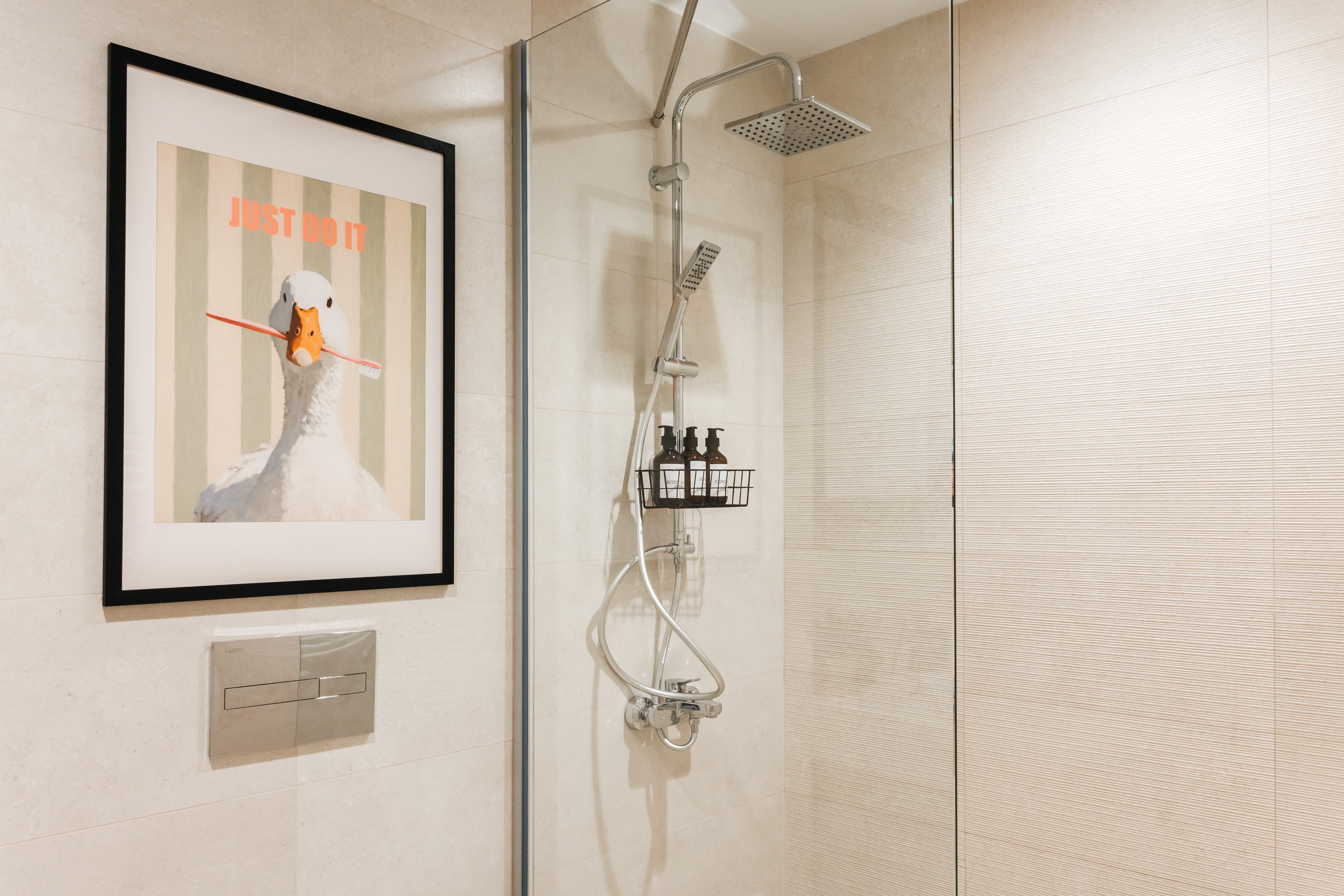 Modern glass shower with rainfall head and playful designer touches