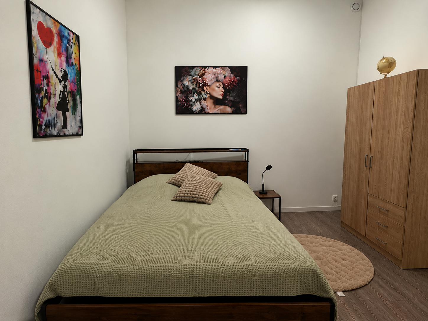 Cozy bedroom with warm wood accents, stylish art, and ample storage