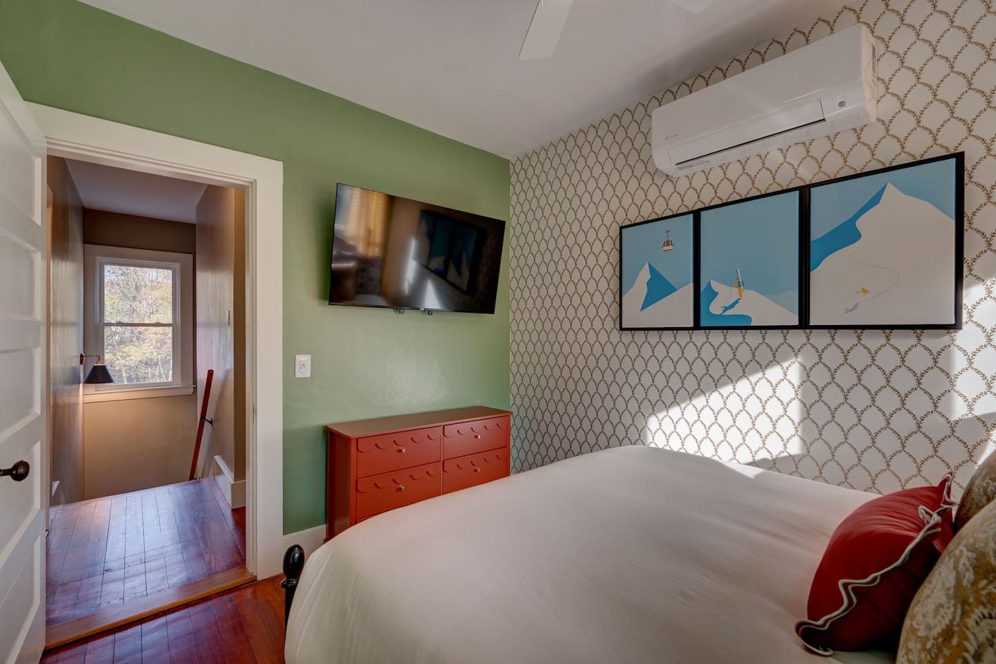 Relax in your designed queen bedroom featuring a comfortable queen bed and Roku TV with Guest Mode. This cozy retreat offers comfort and entertainment after a day of skiing, hiking, or exploring North Conway and the White Mountains.