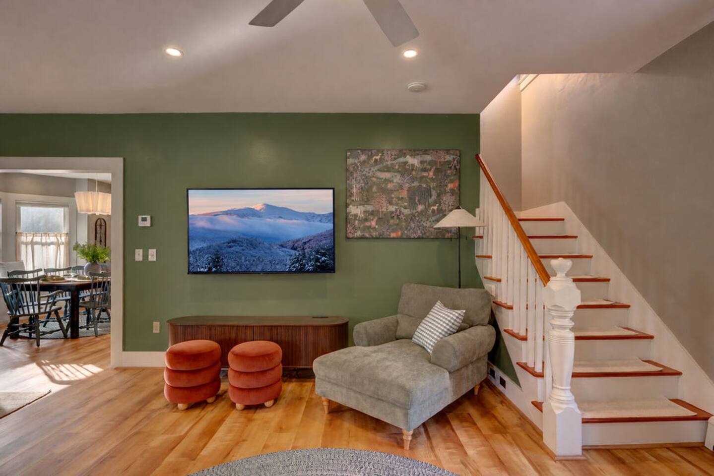 Relax in the living room featuring a cozy fireplace, record player, and Roku TV with Guest Mode. Perfect for movie nights, music, or gathering with family and friends after skiing, hiking, or exploring North Conway and the White Mountains.