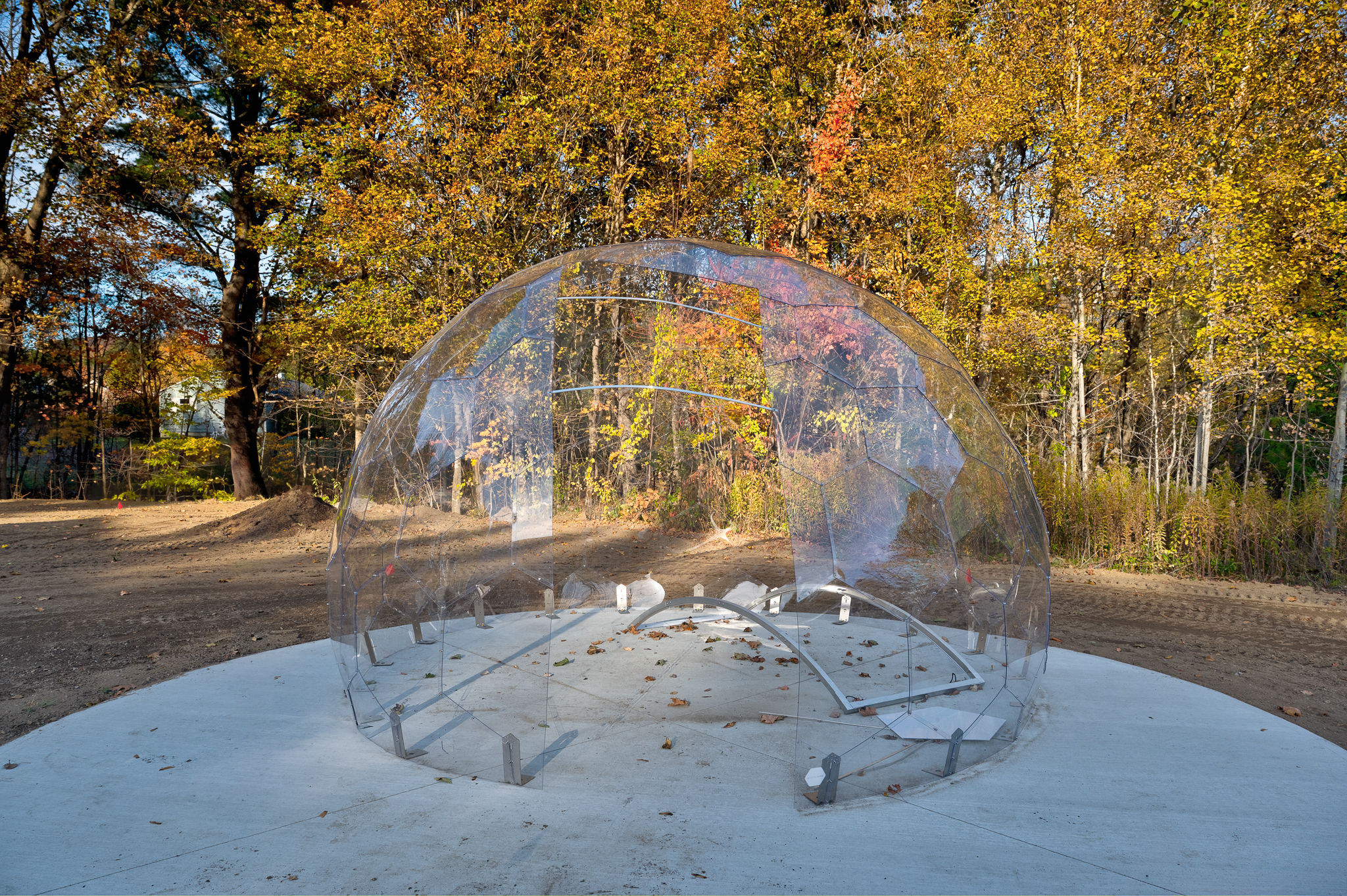 Unique clear dome nestled among stunning autumn trees