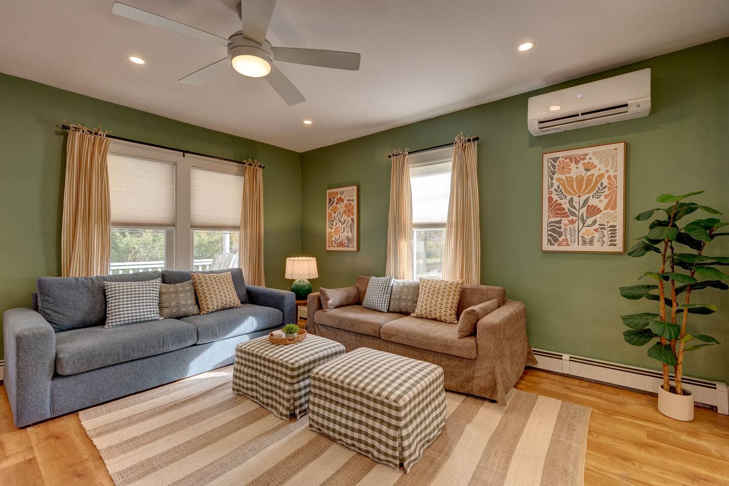 Relax in the living room featuring a cozy fireplace, record player, and Roku TV with Guest Mode. Perfect for movie nights, music, or gathering with family and friends after skiing, hiking, or exploring North Conway and the White Mountains.