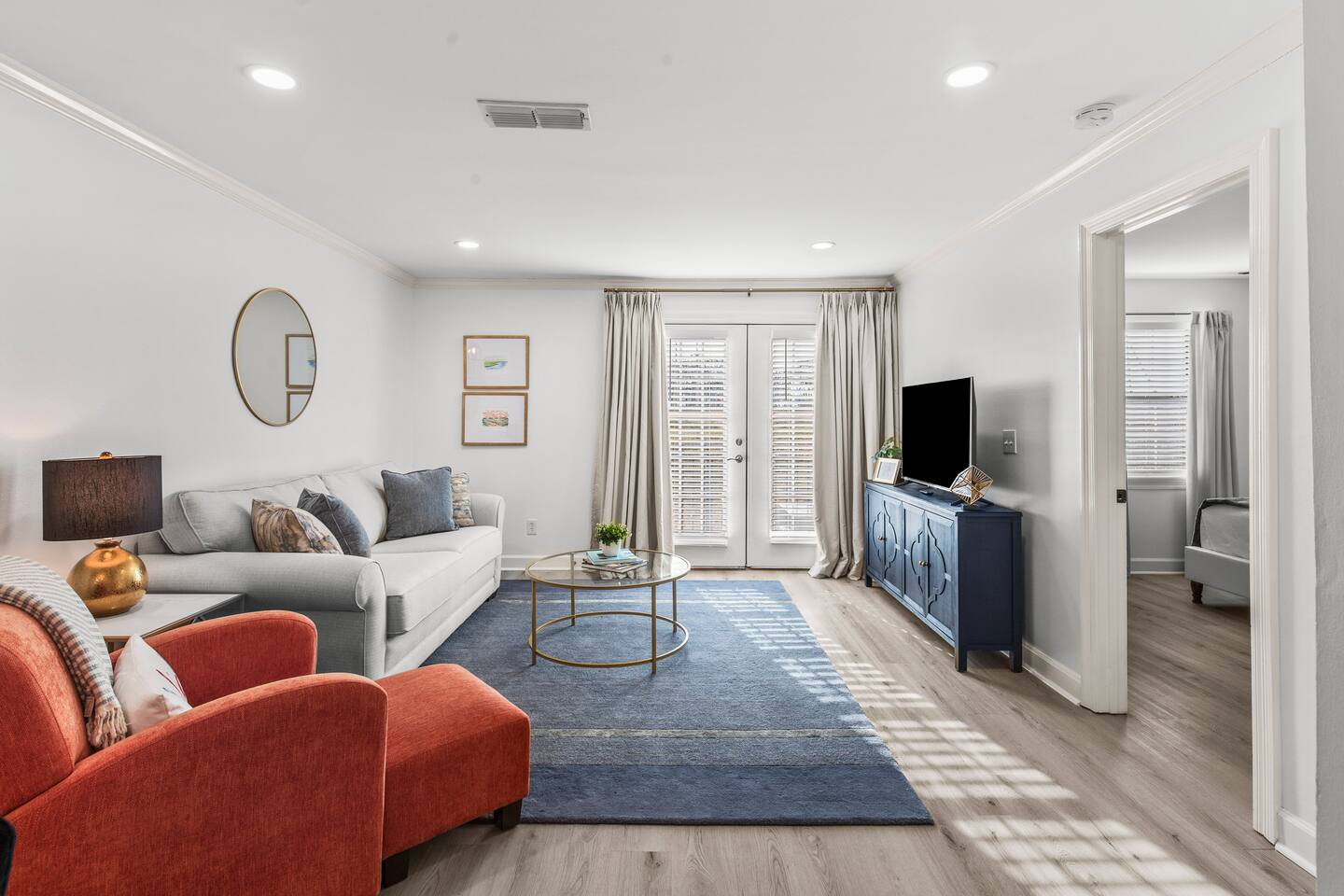 Plenty of space to spread out in this roomy living area. This room features a queen sized pullout sofa, blackout curtains and a large TV.
