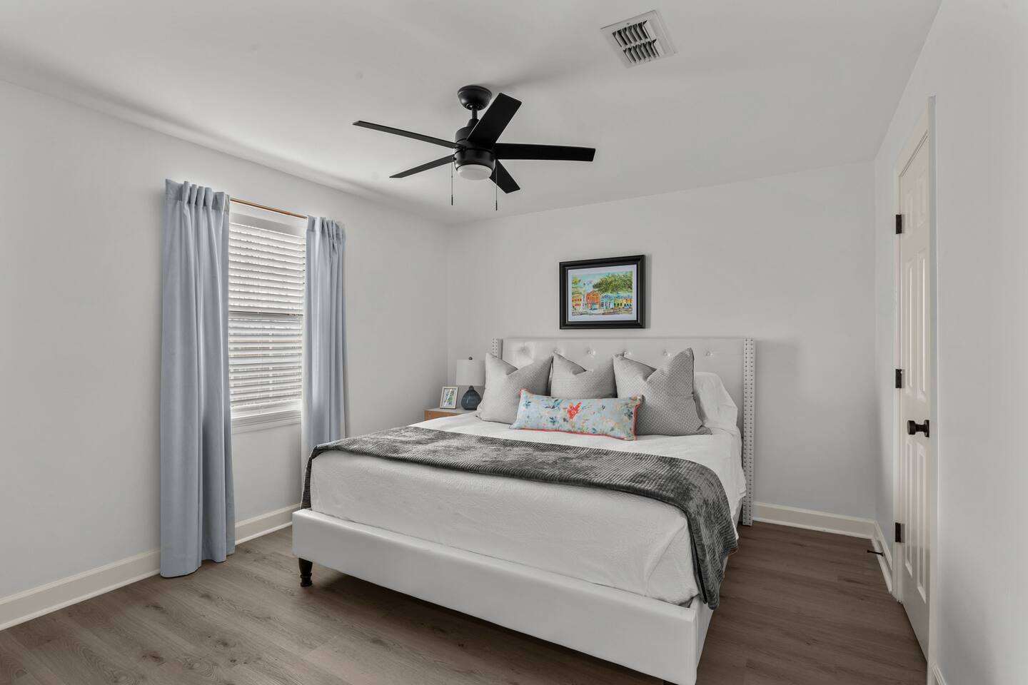 Bedroom 2 is a king ensuite with a full bathroom, walk-in closet, blackout curtains with a TV.