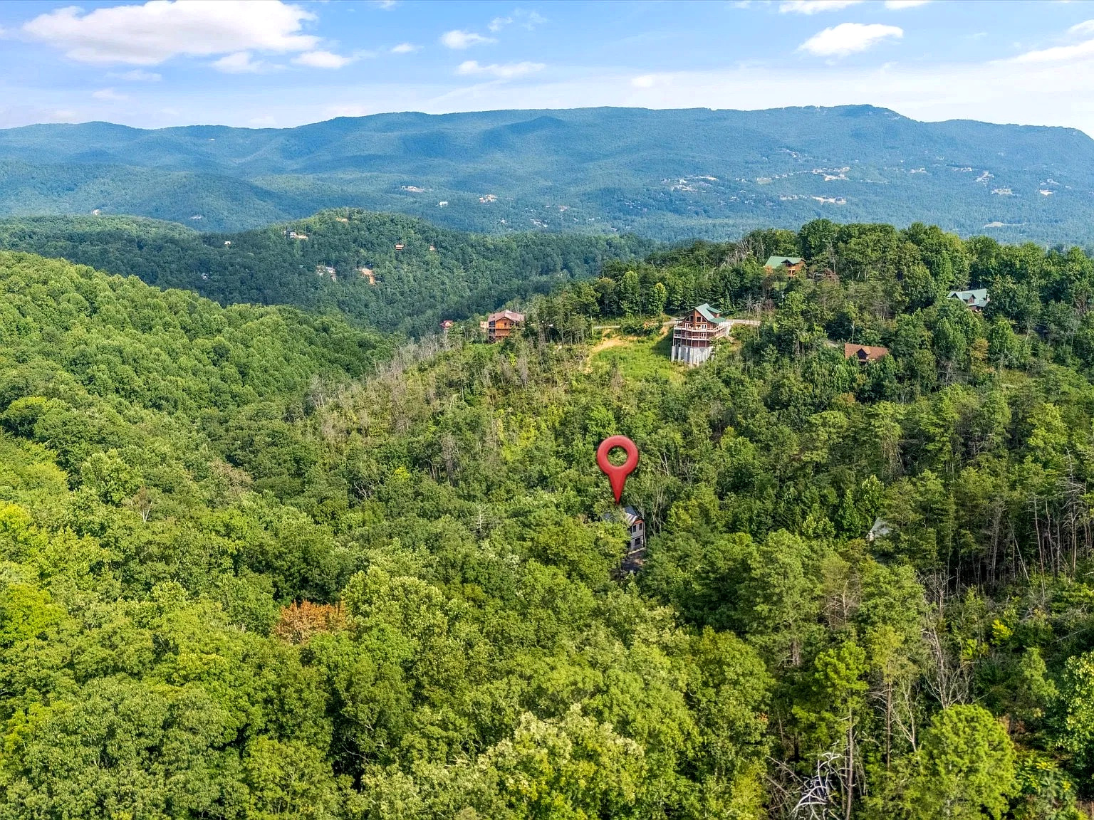 Secluded mountain retreat surrounded by lush forest and scenic views