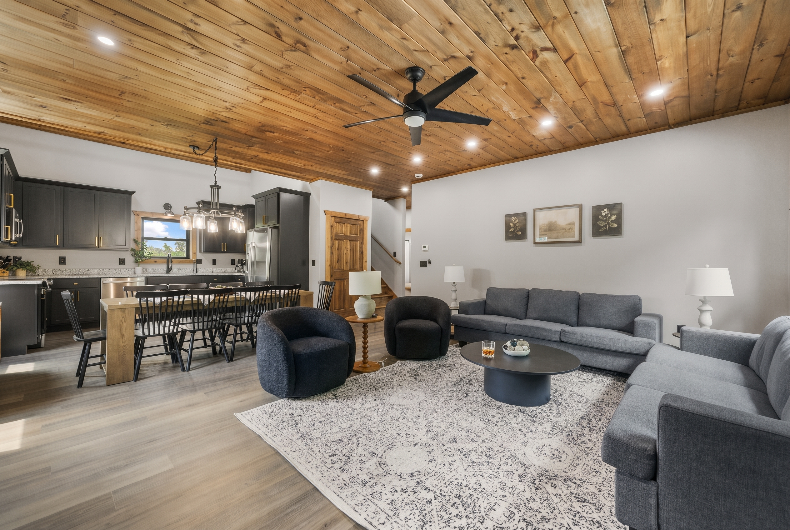 Spacious open living area with cozy seating and rustic-modern charm