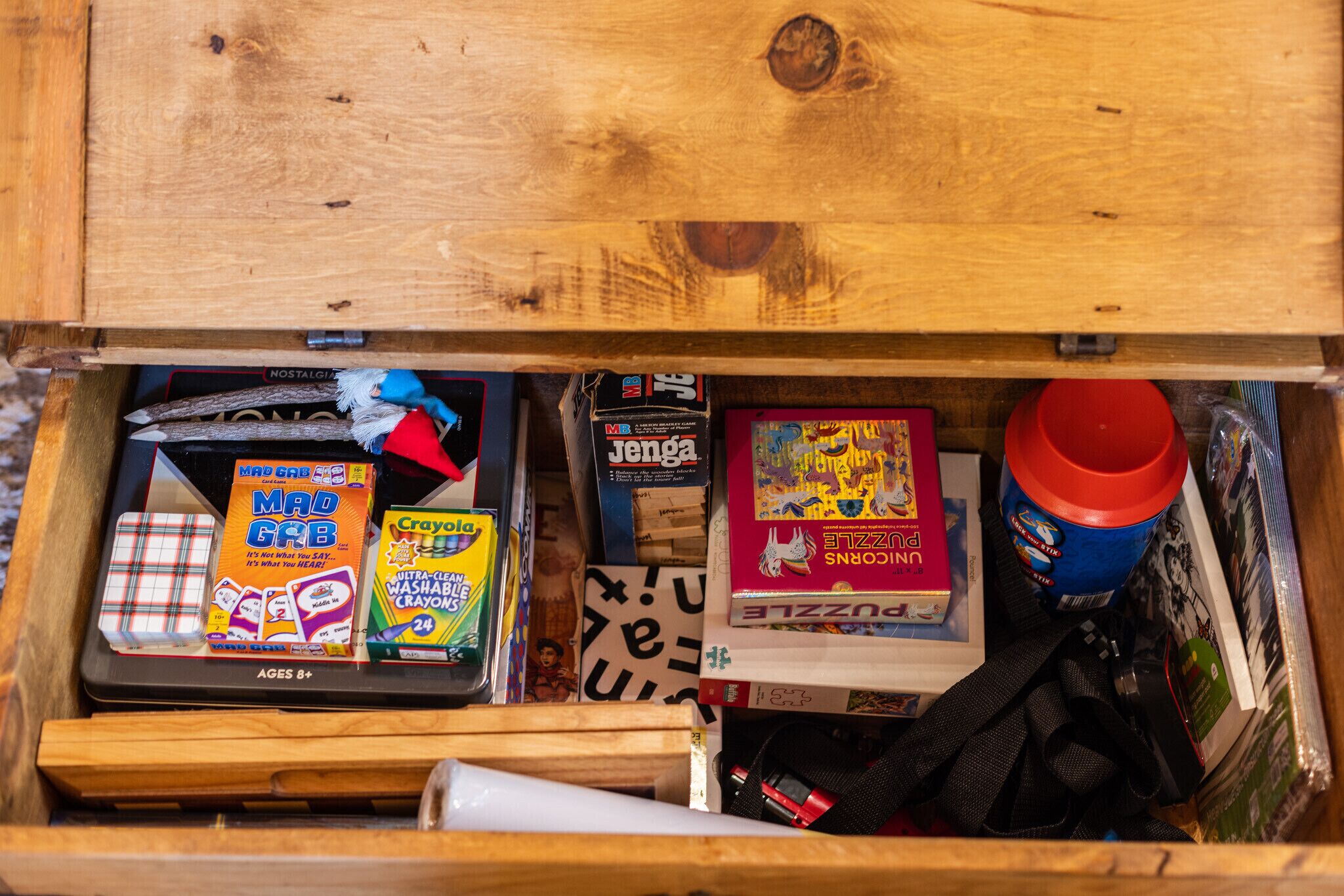 Open the coffee table and you’ll find lots to do on a rainy night.