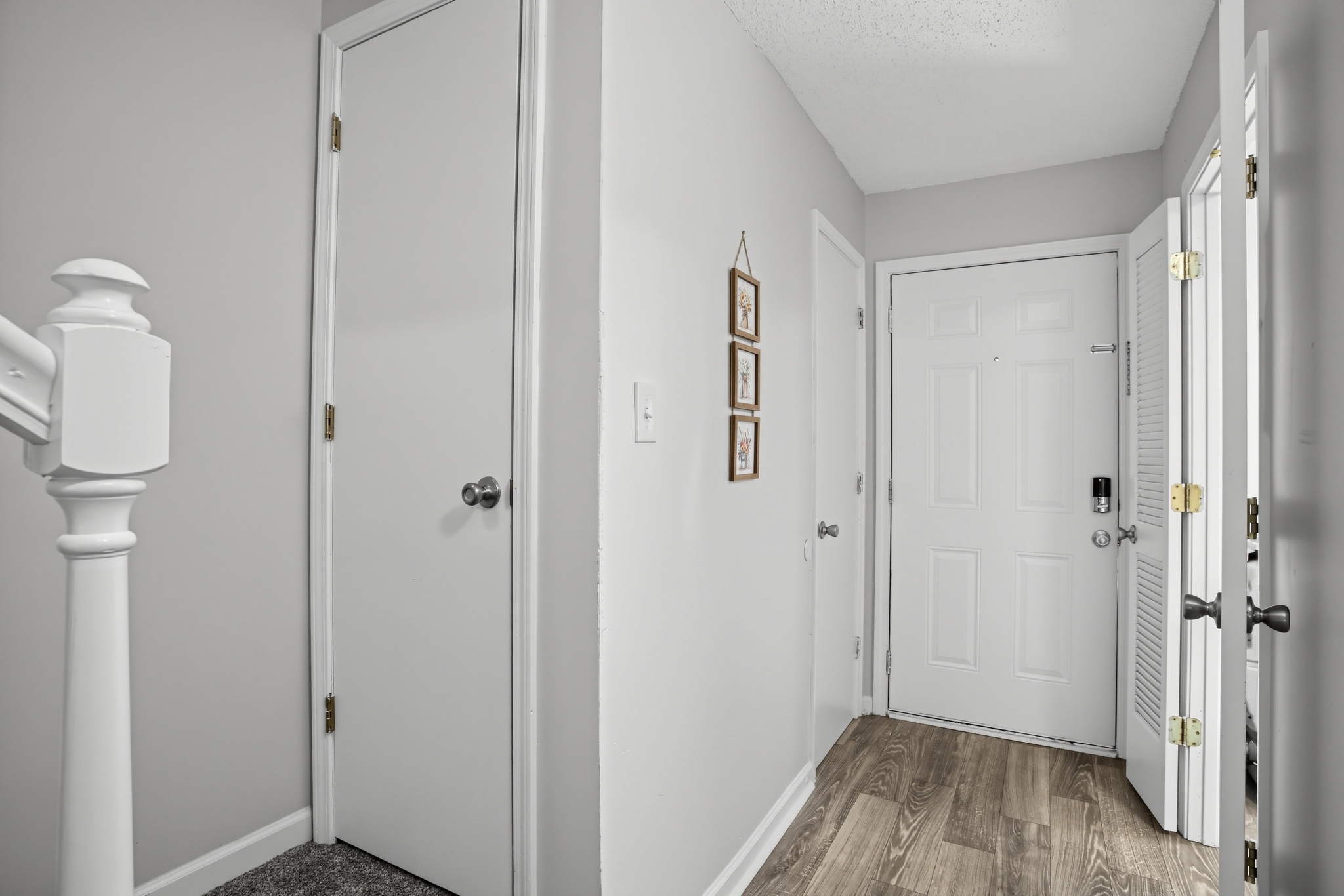 Bright, modern entry hall with wood-look floors and a clean welcome