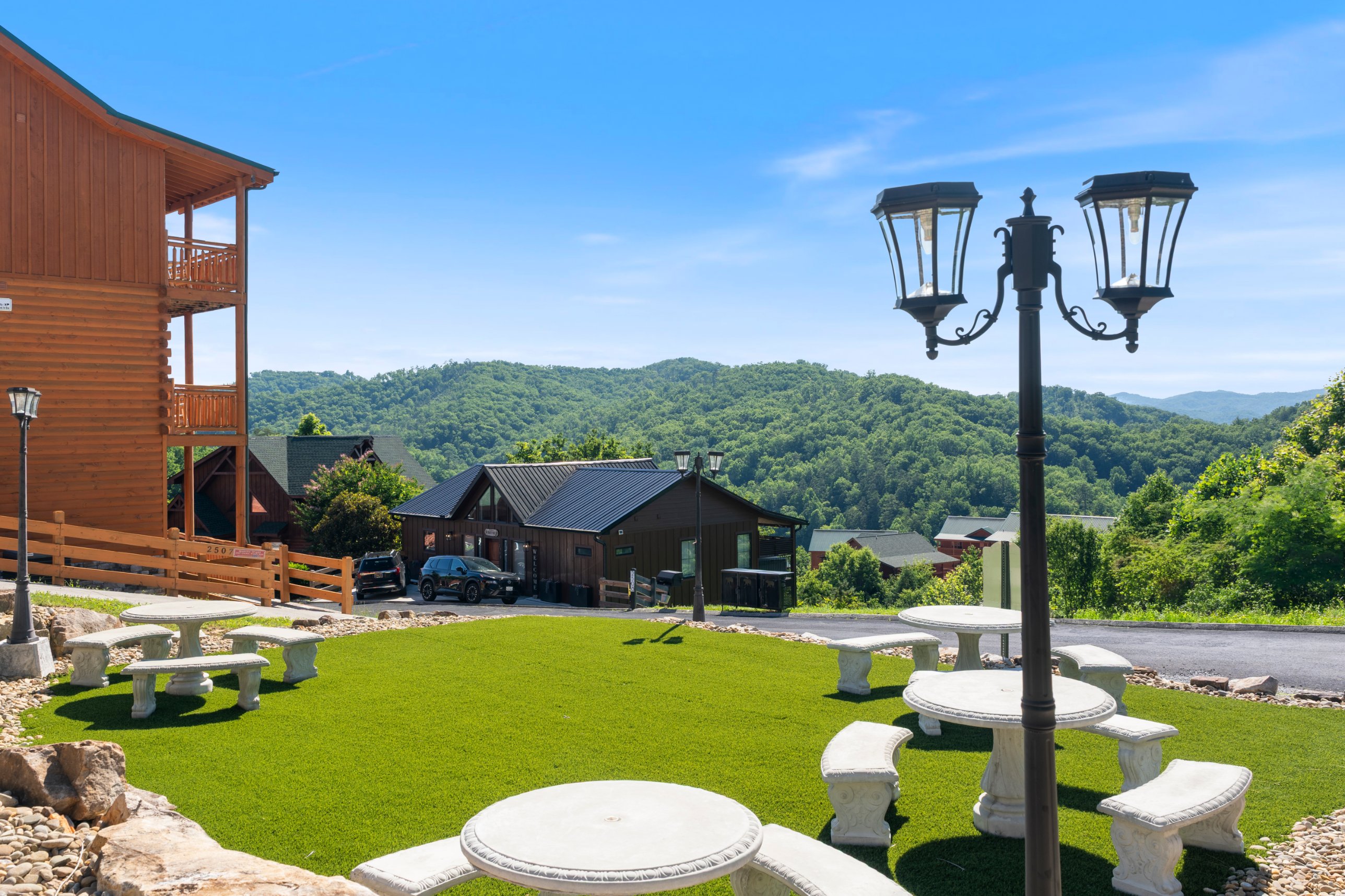 Laurel Point greenspace with mountain views and picnic tables, shared with other cabins in the community.