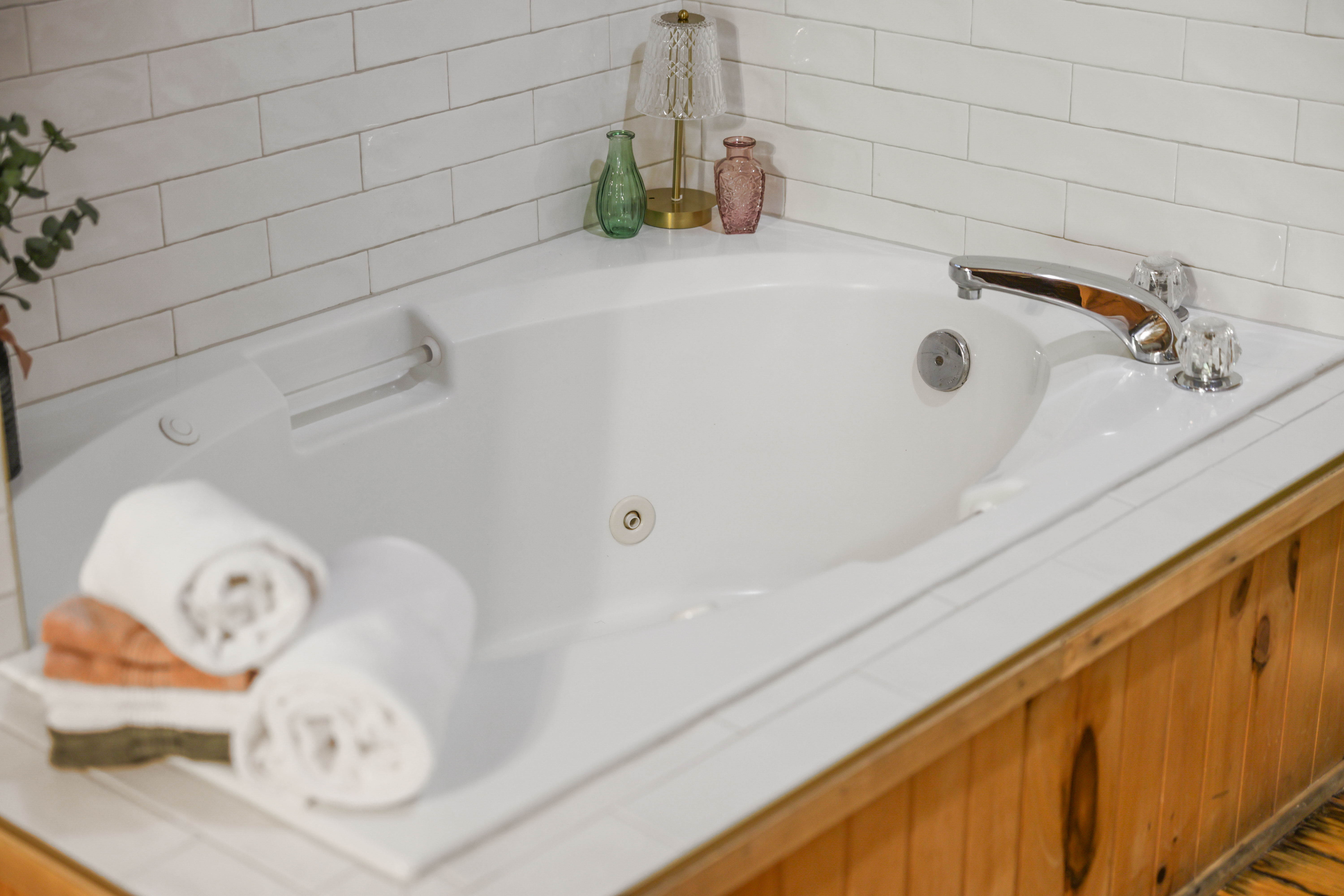 Relax in a spacious soaking tub with cozy spa-style touches