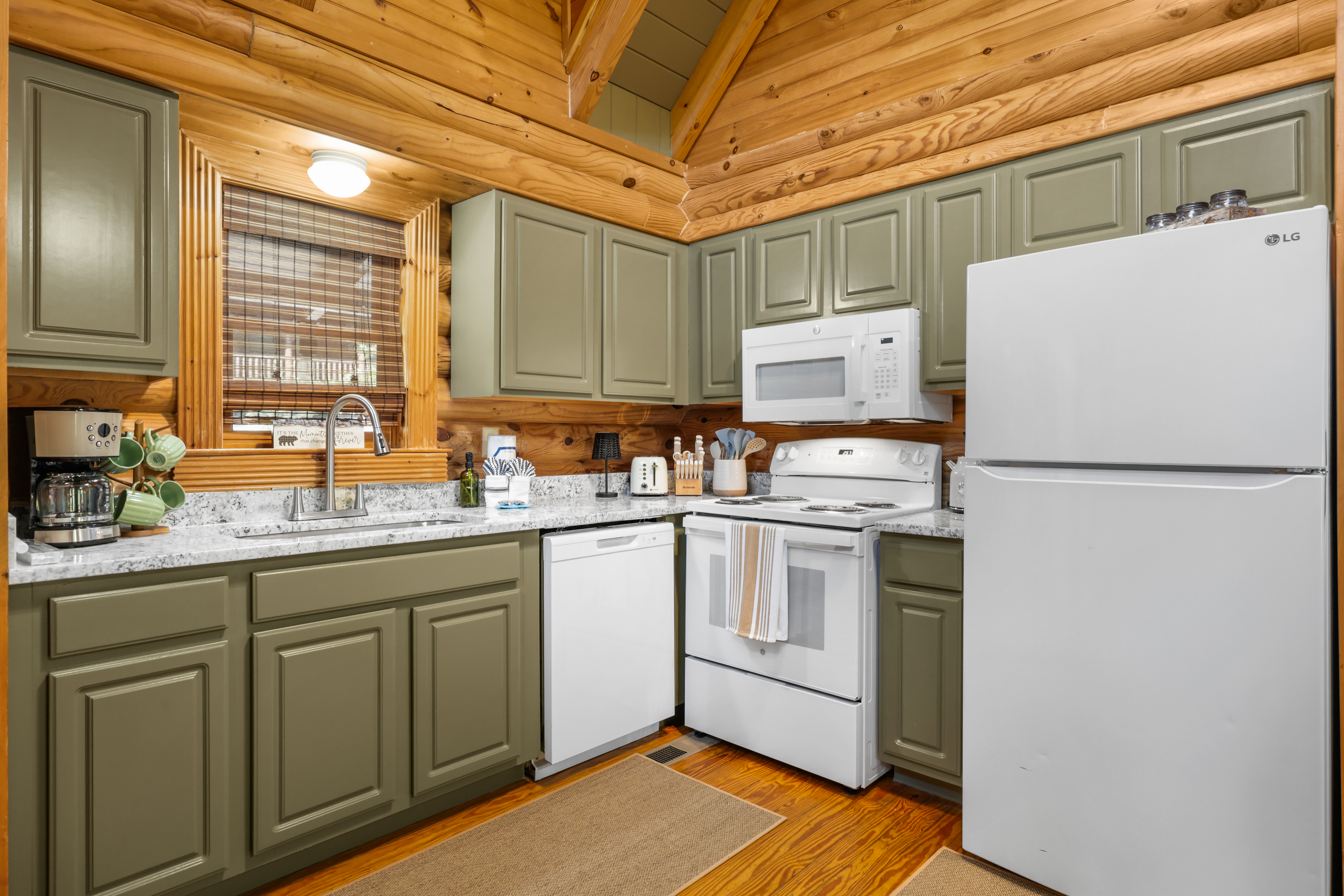 Rustic cabin kitchen with full-size appliances and warm wood charm