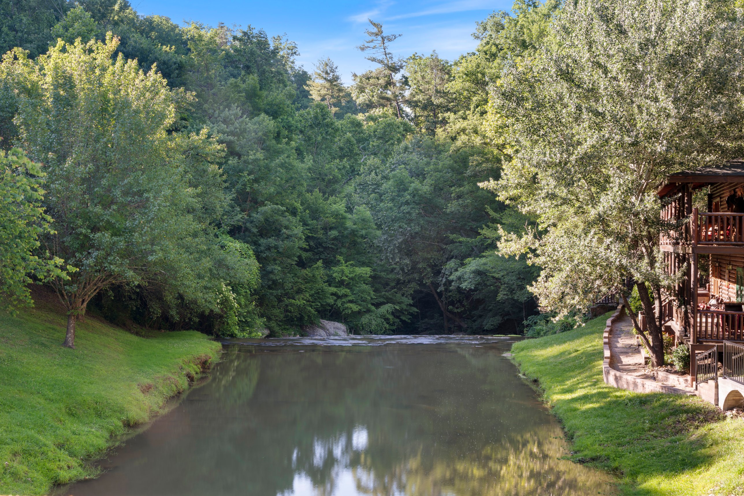 The natural creek running through Smoky Mountain Ridge, a shared community view. Supervise children near the water.