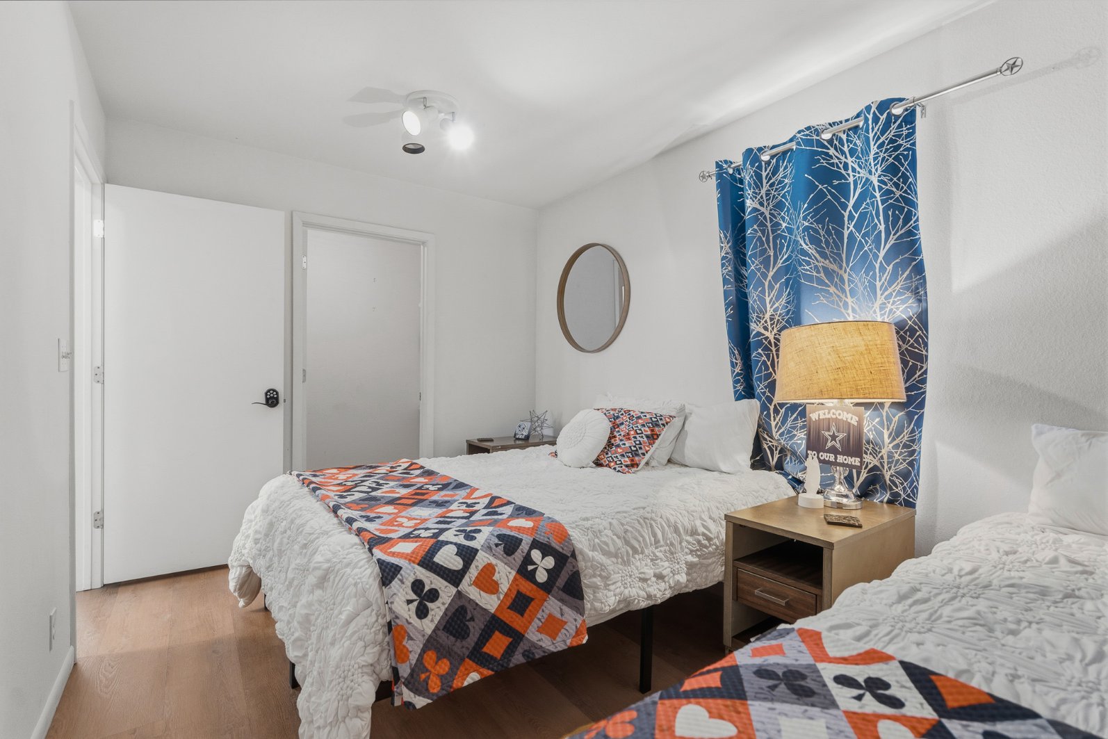 Bright twin-bed room with cozy decor and cheerful modern accents