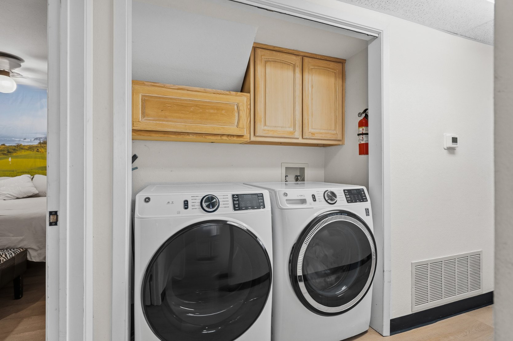 Convenient in-unit washer/dryer with added cabinet storage