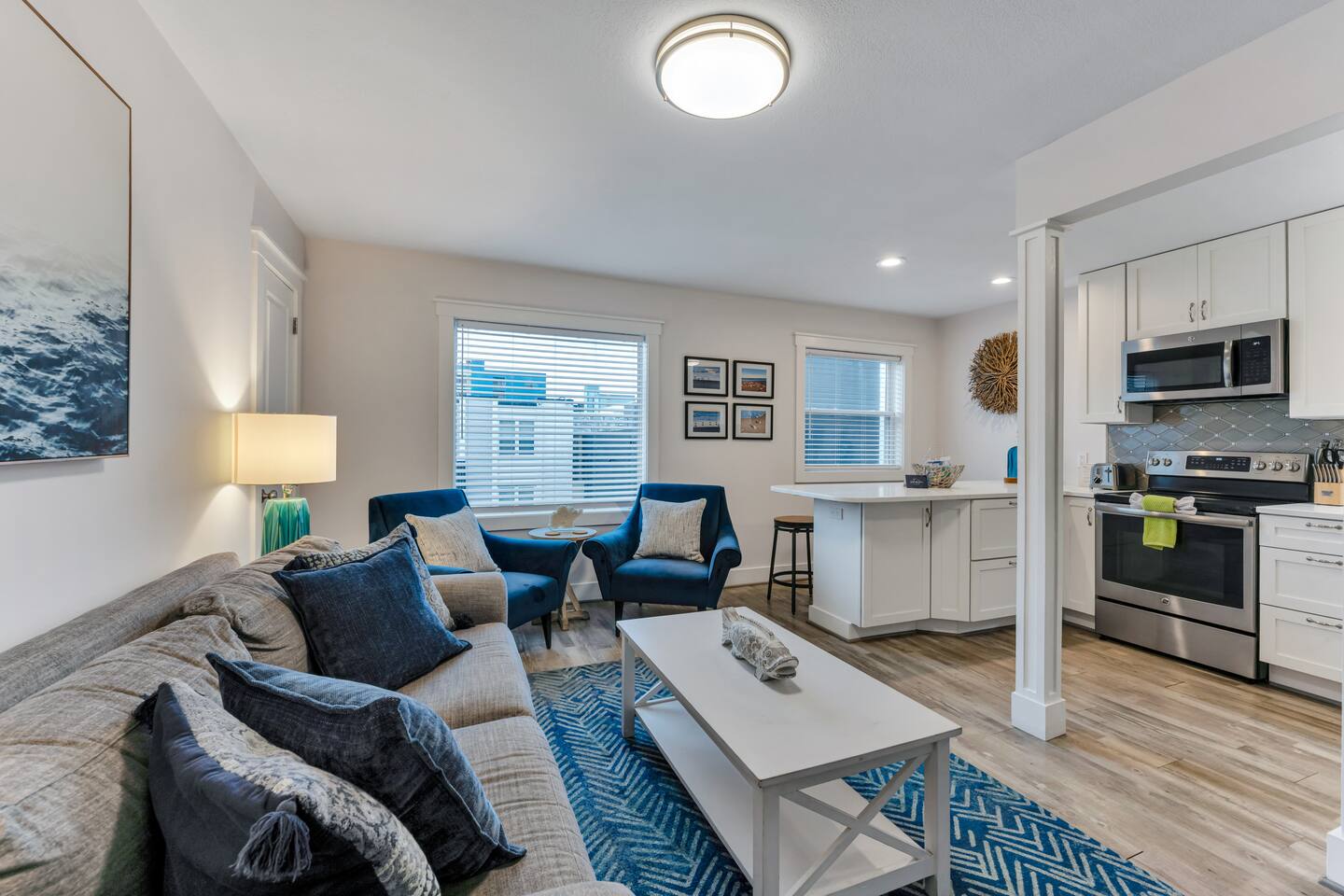 Cozy seating area with blue accent chairs and natural light