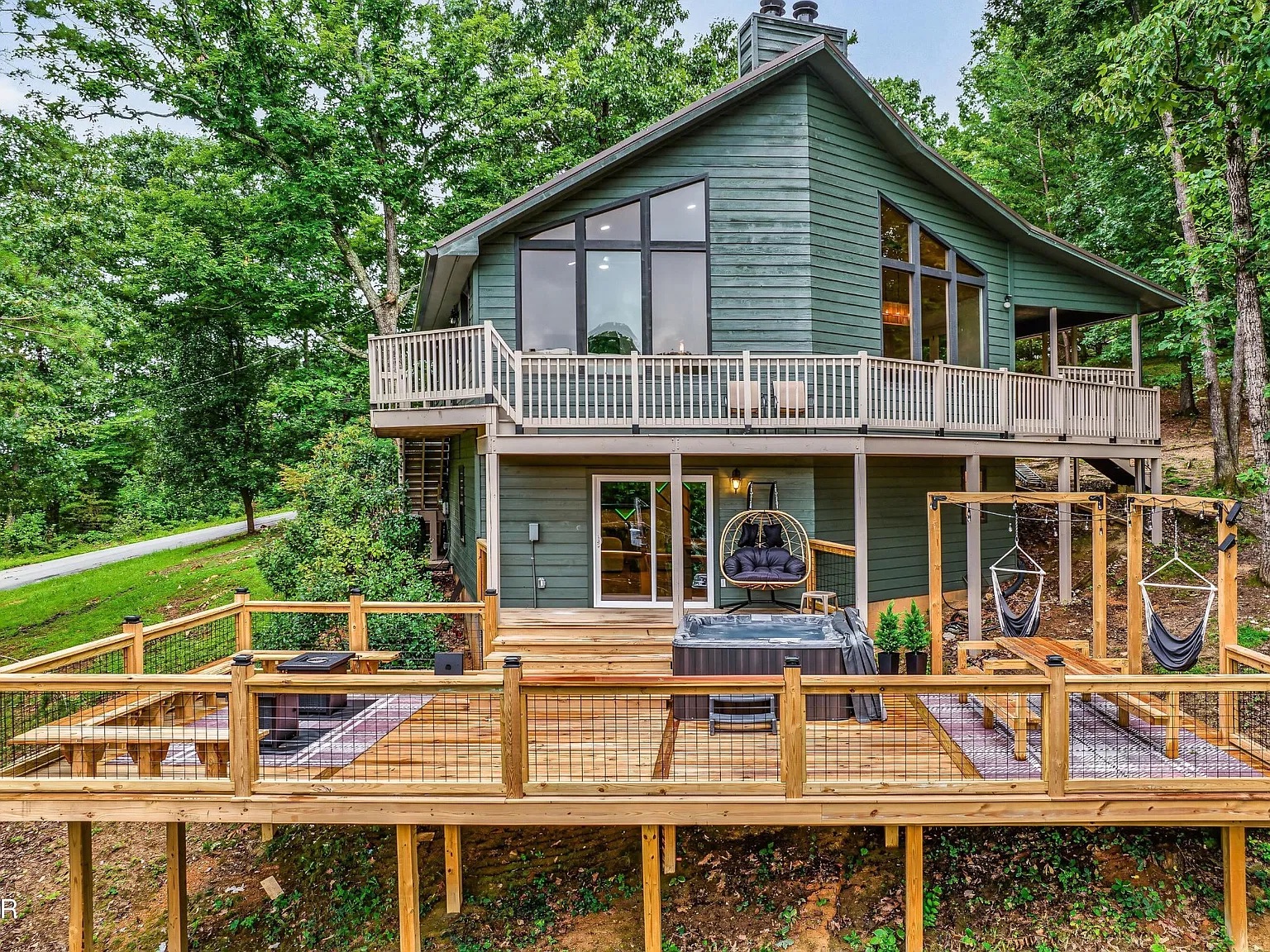 Wooded retreat with hot tub, fire pit, and expansive wraparound deck