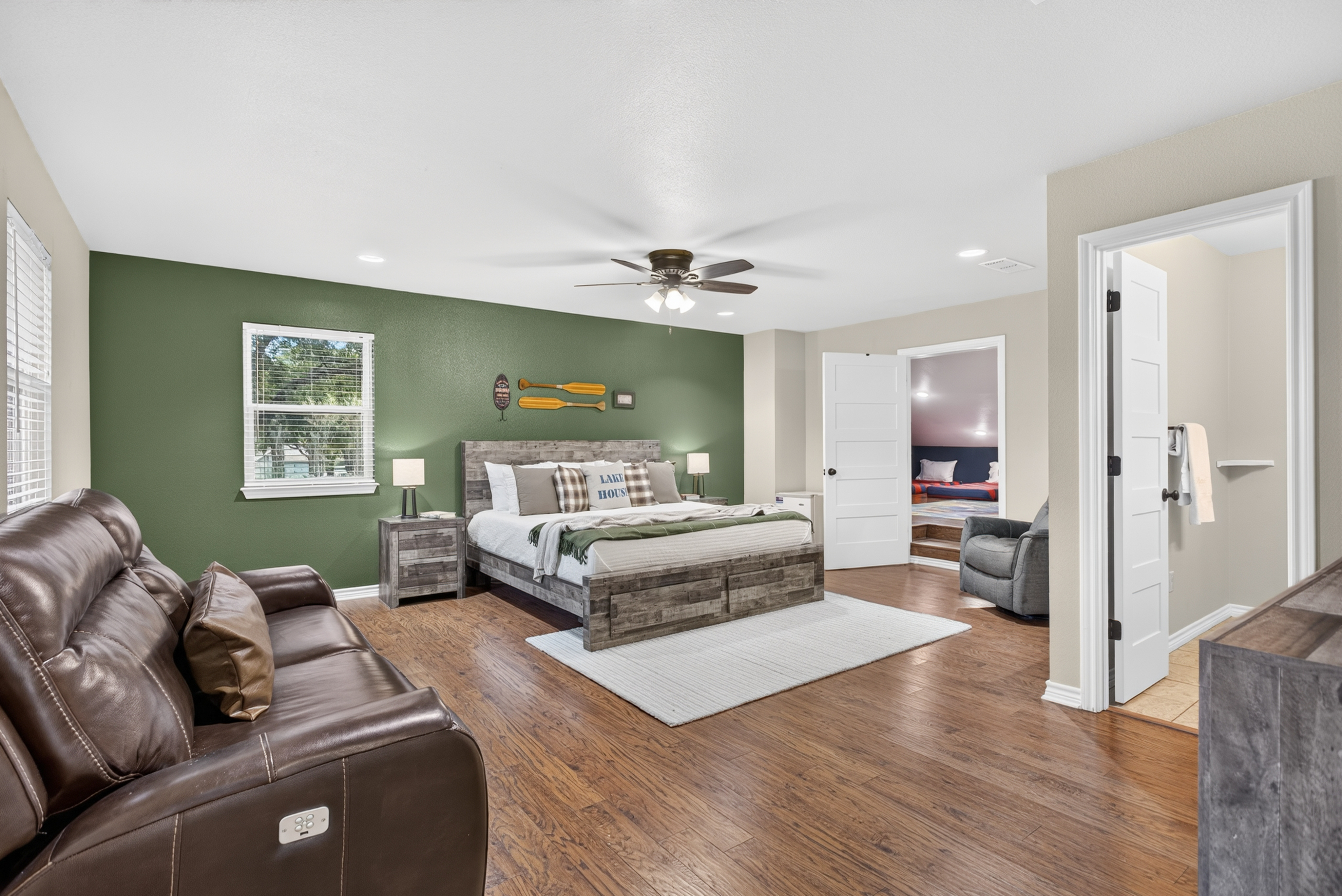 Spacious king suite with sofa, en suite bath, and connected bunk room