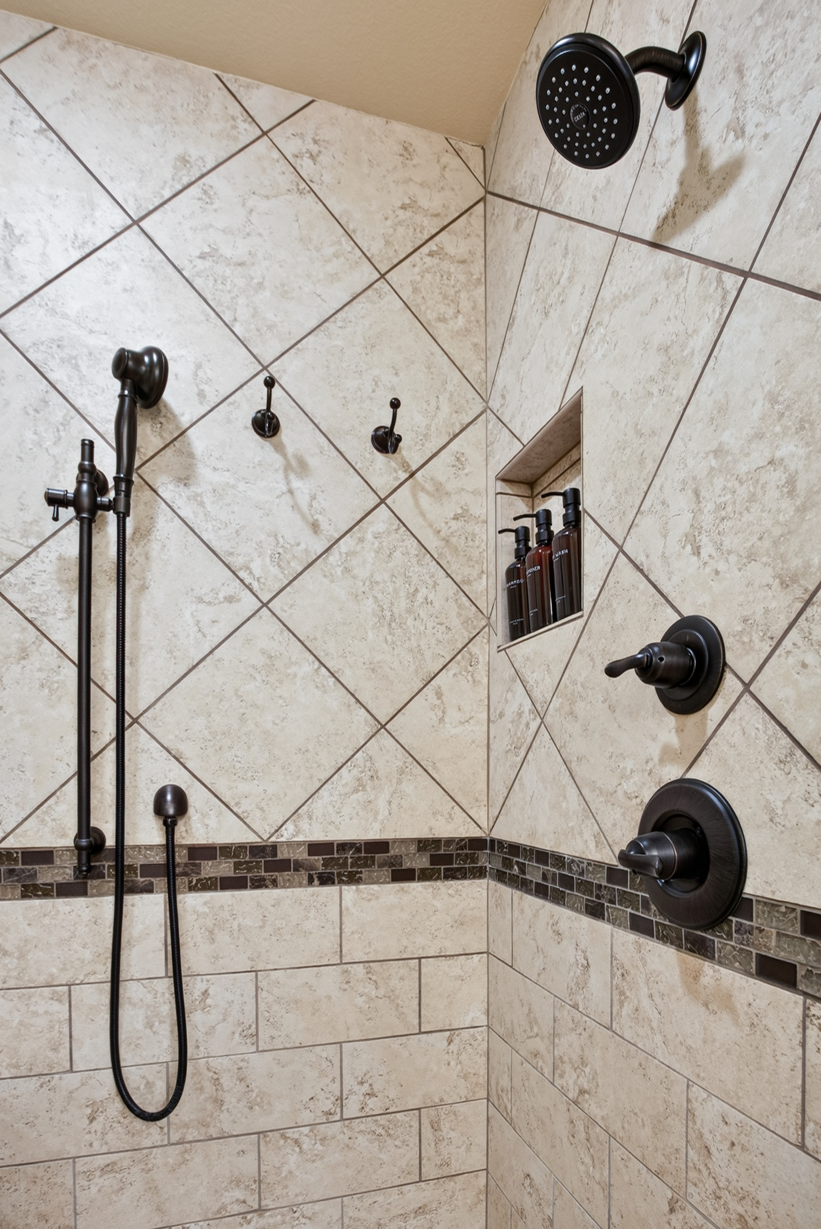 Spa-style tiled shower with rainfall head and handheld sprayer