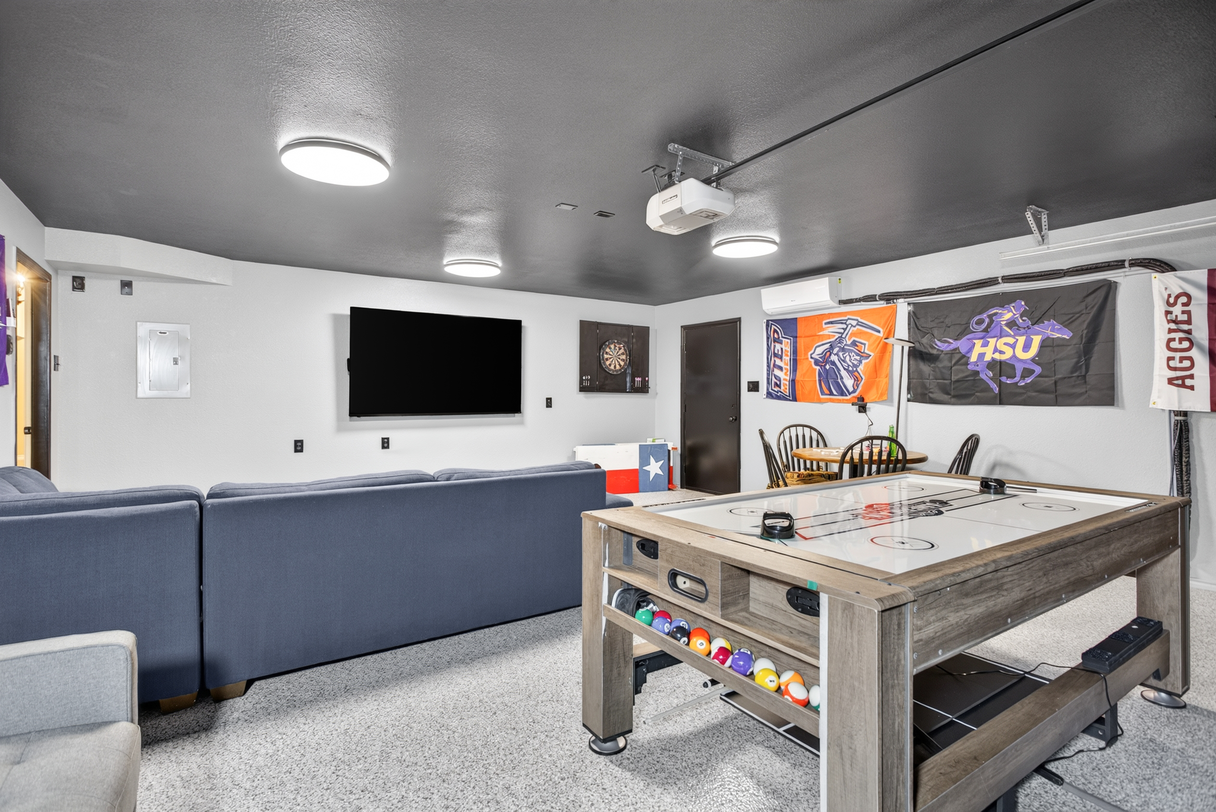 Game room fun with air hockey, big-screen TV, and comfy lounge seating