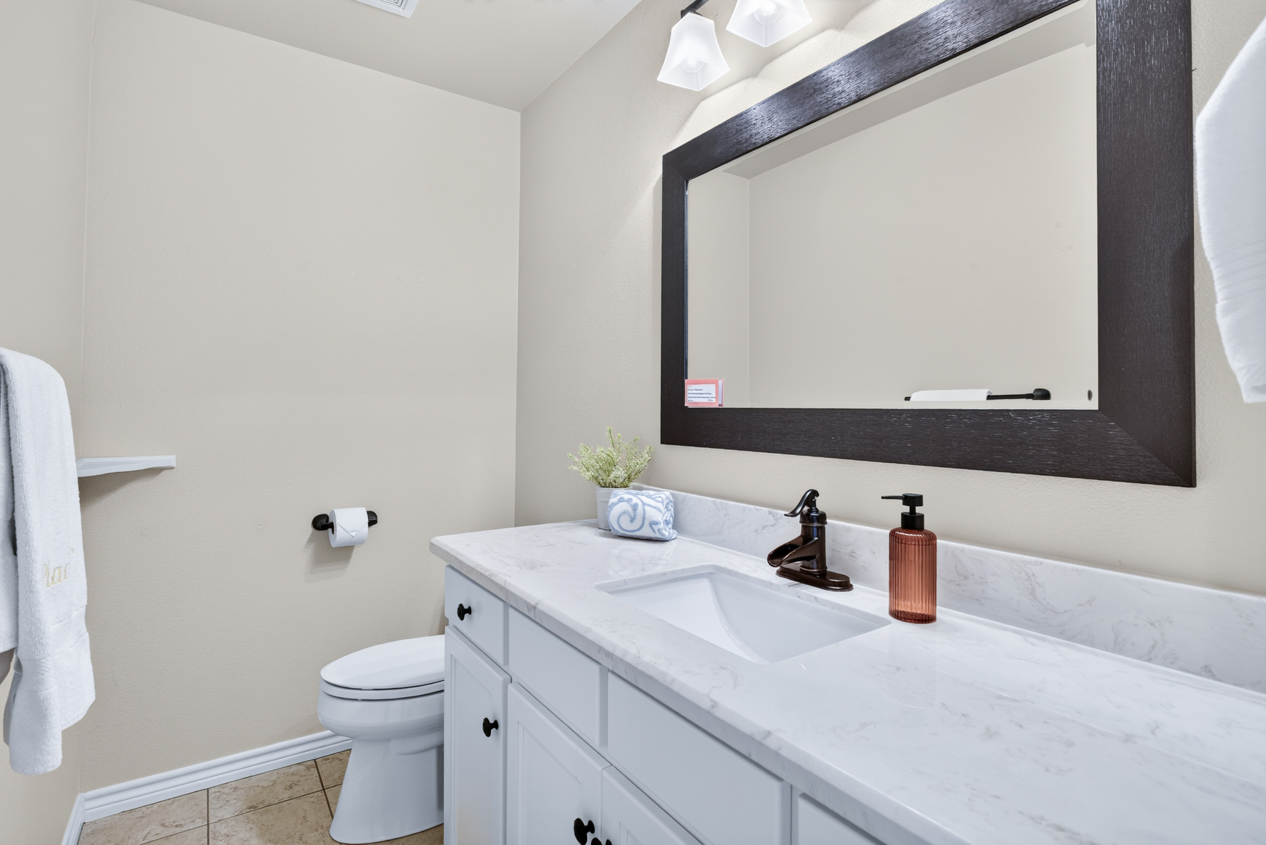 Bright bathroom with spacious vanity and elegant modern finishes
