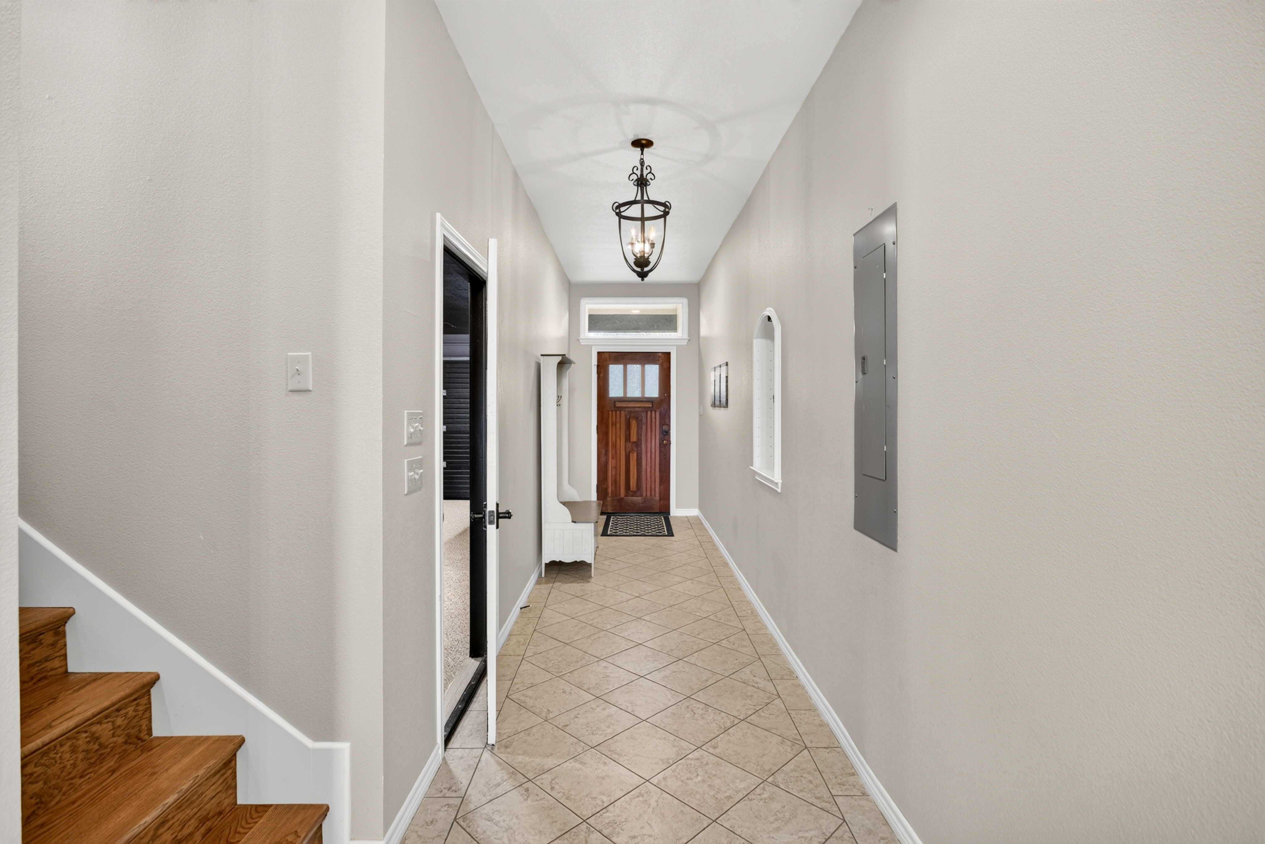 Bright, spacious entryway with soaring ceilings and elegant details
