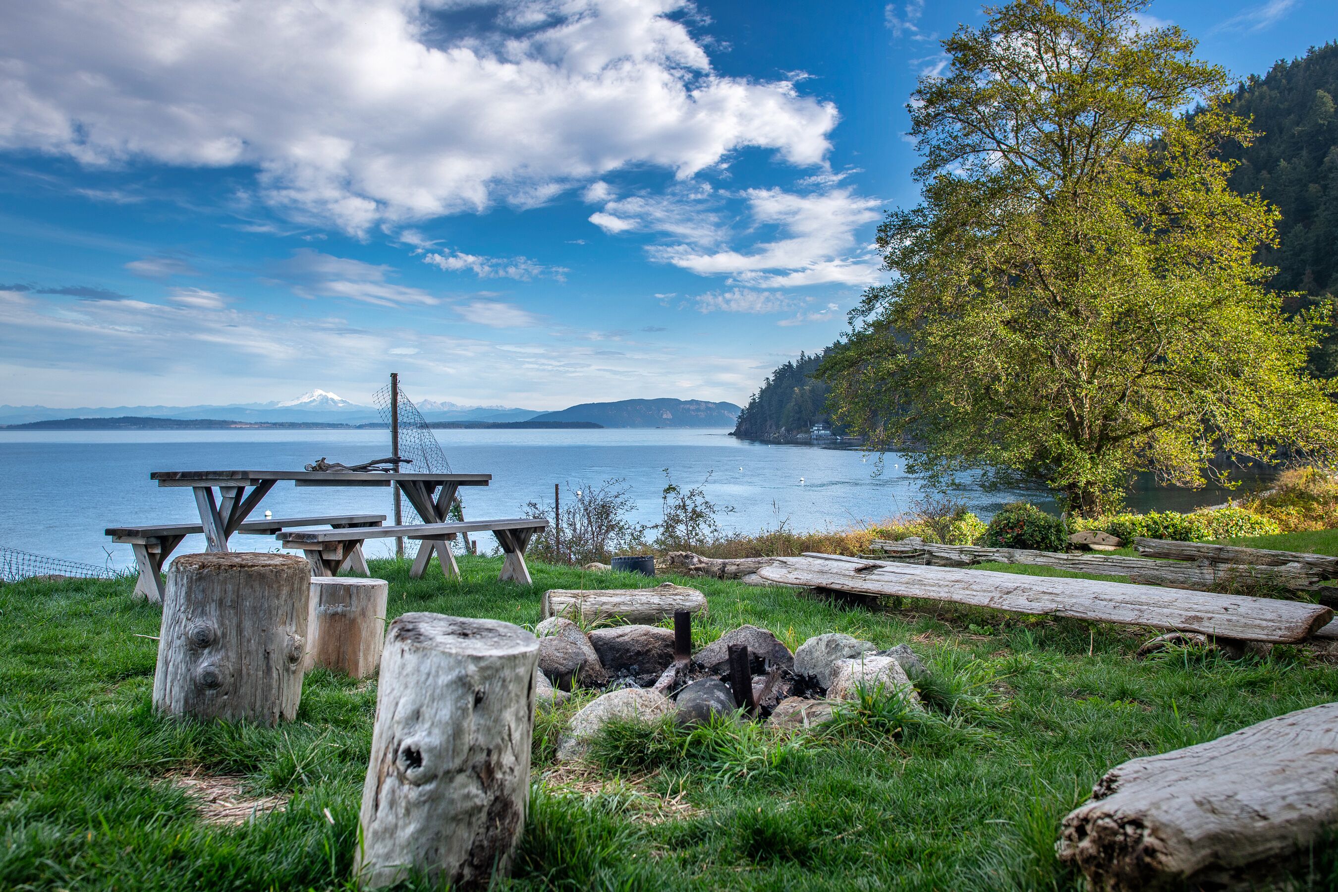 To the right of the deck, ocean-front picnic table, fire pit, BBQ