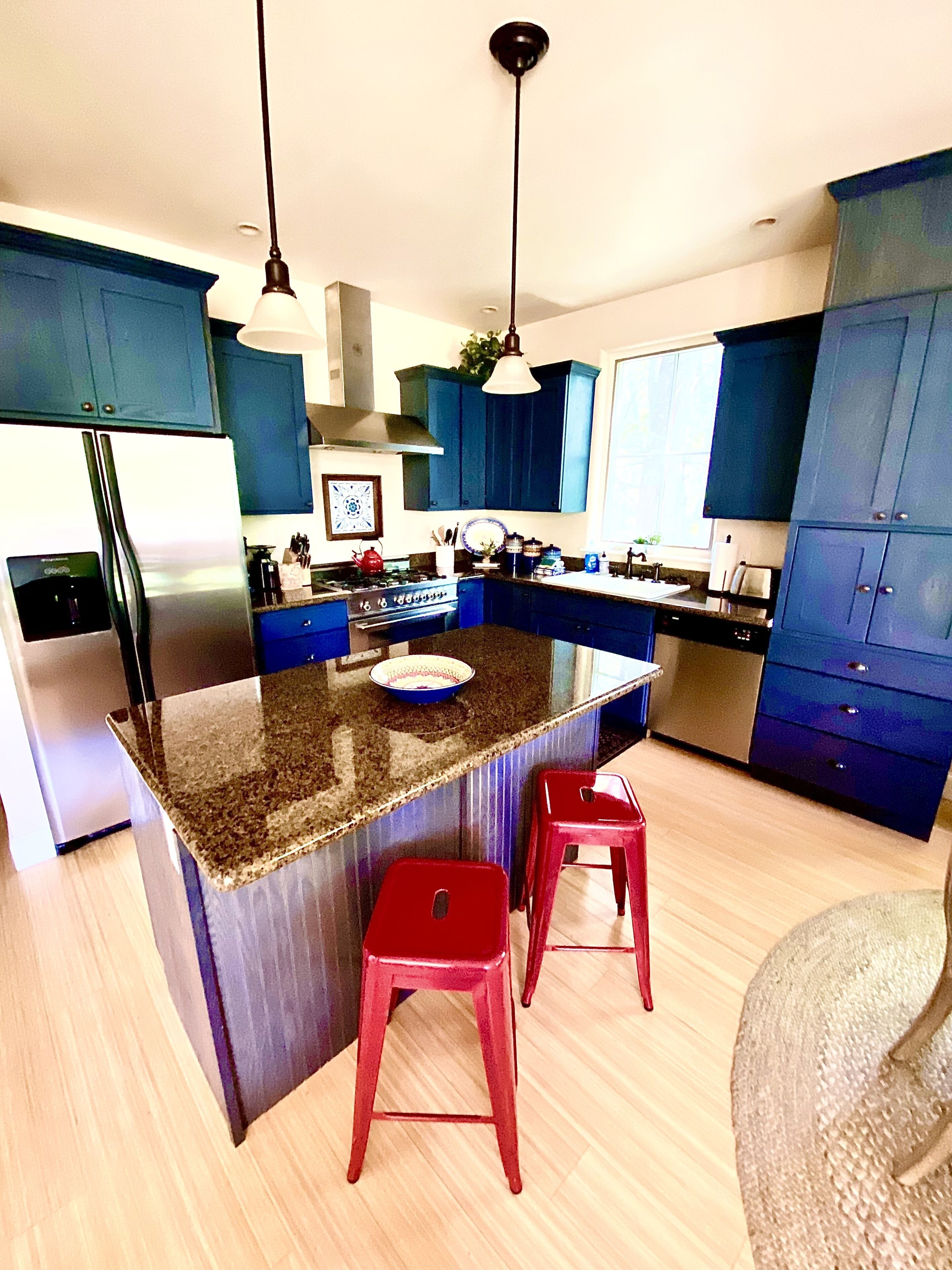 The kitchen island is perfect for morning coffee or additional counter space