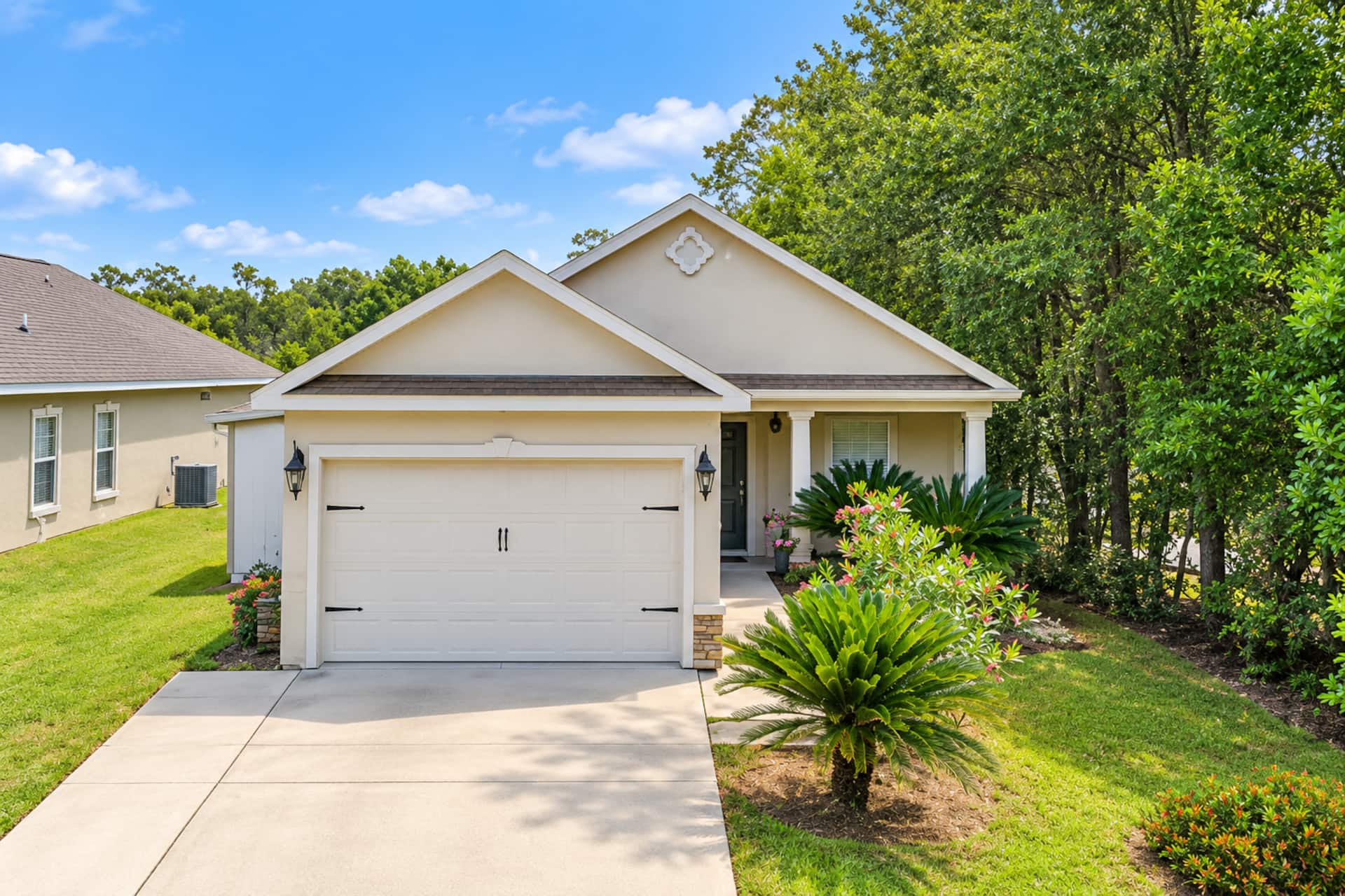 Charming single-story home with lush landscaping and inviting curb appeal