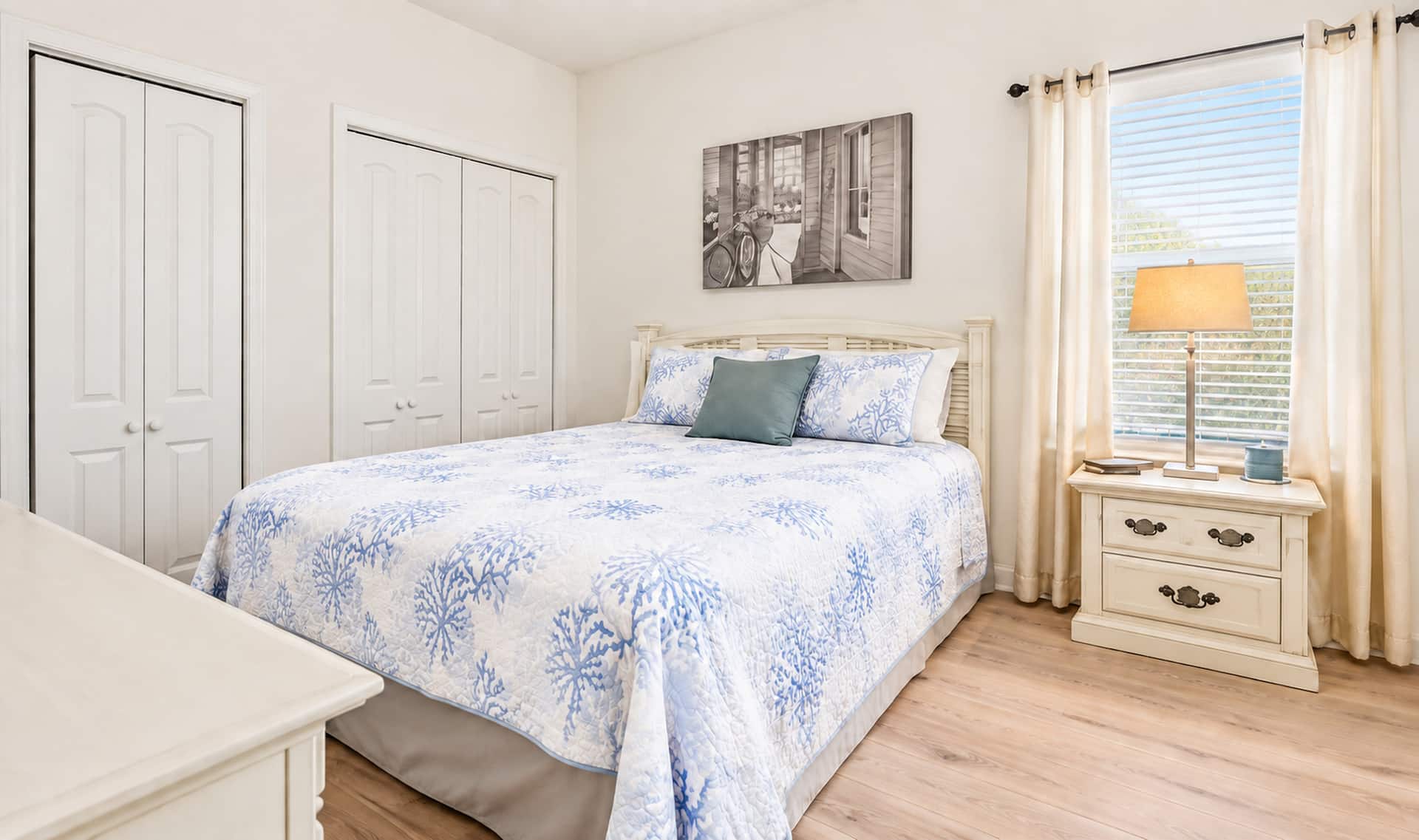 Bright coastal bedroom with natural light and spacious closets