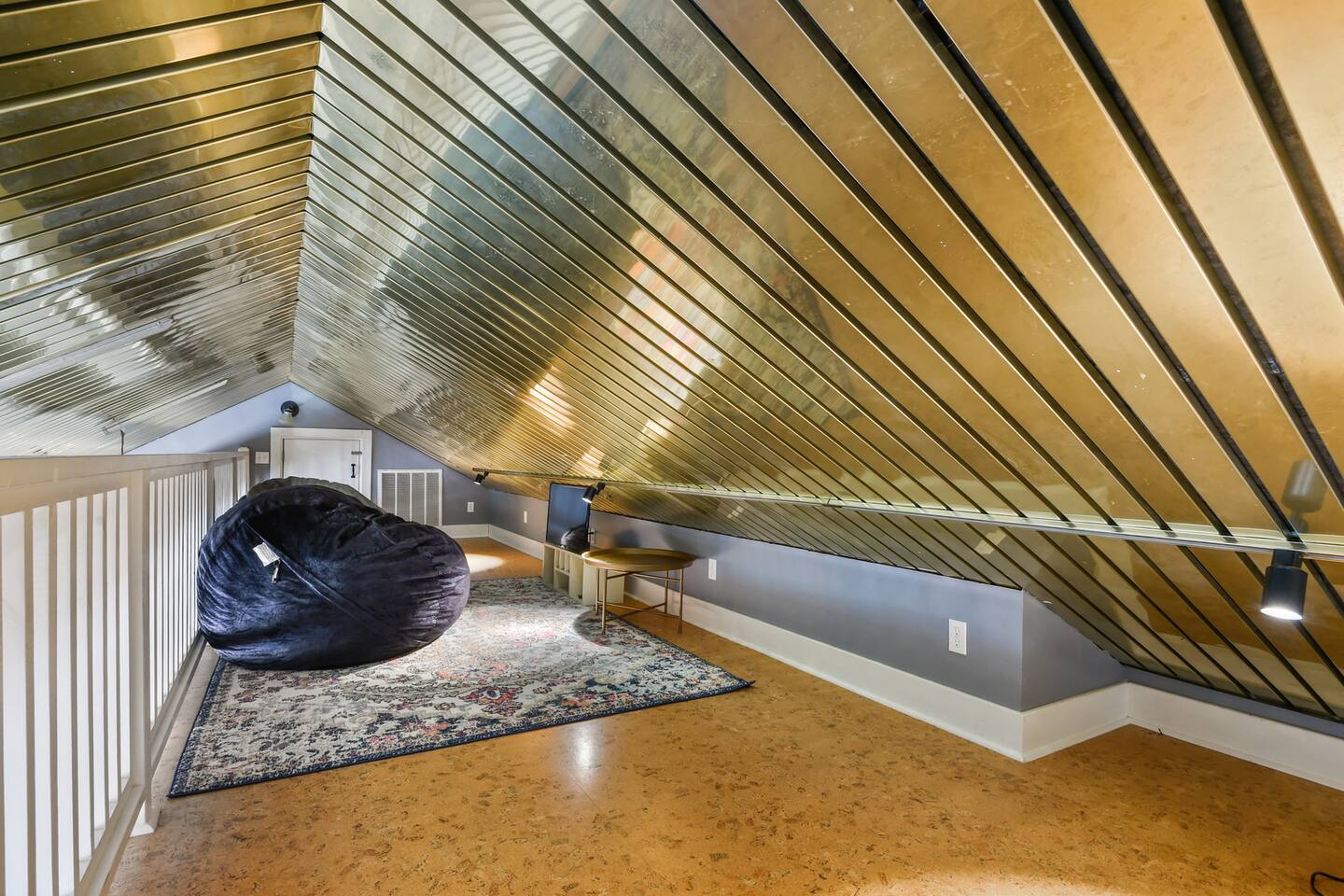 Loft area with bean bags and small tv for kids