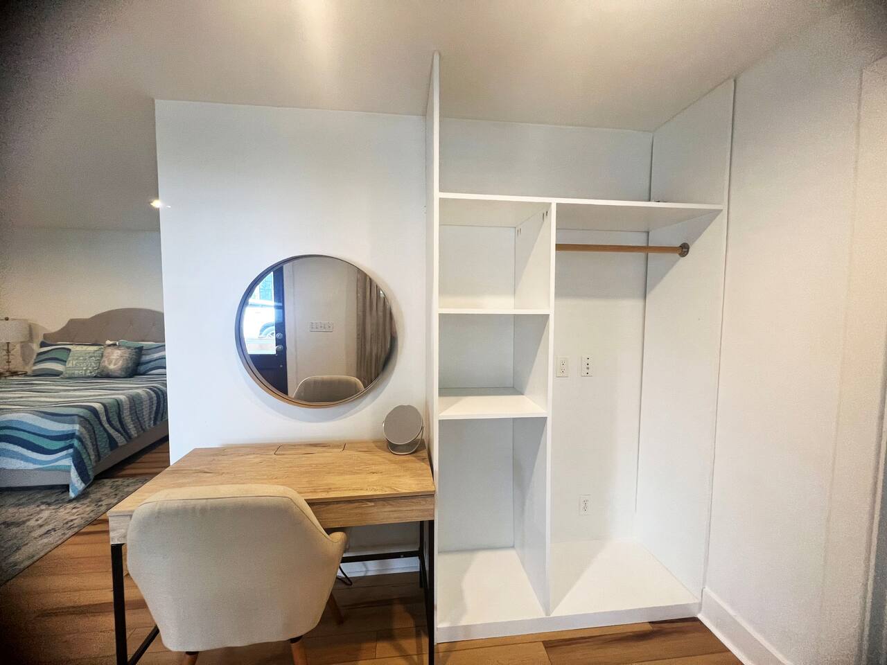Clothes hanging/luggage area with vanity space