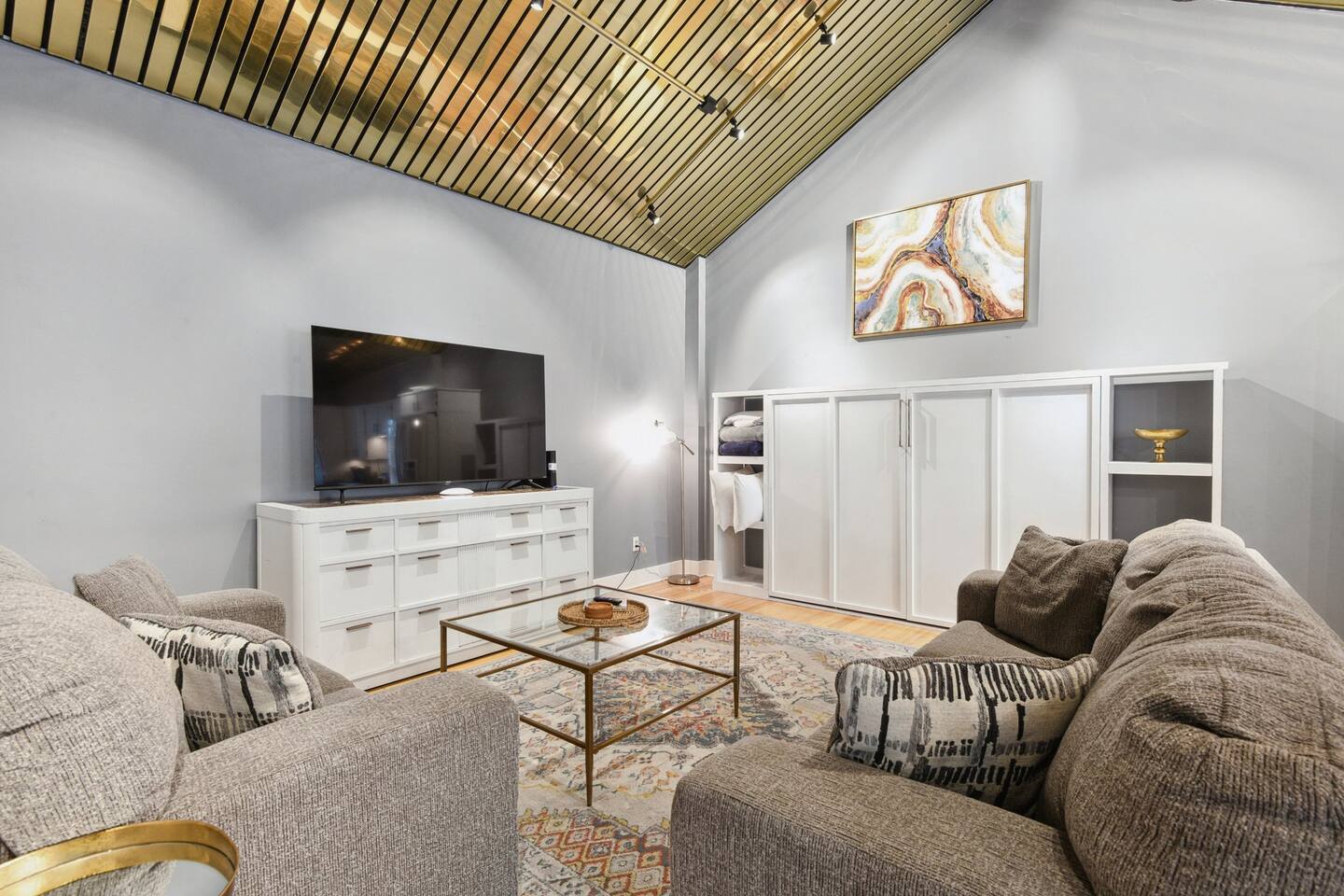 Living room area with large Queen murphy bed