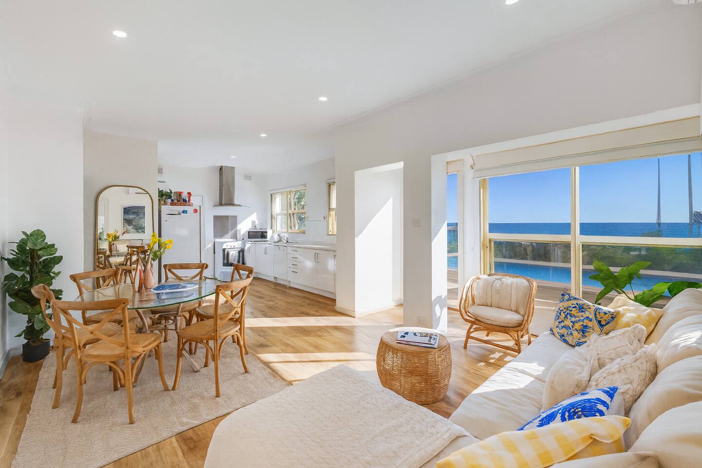 Sunlit living room with sweeping sea views