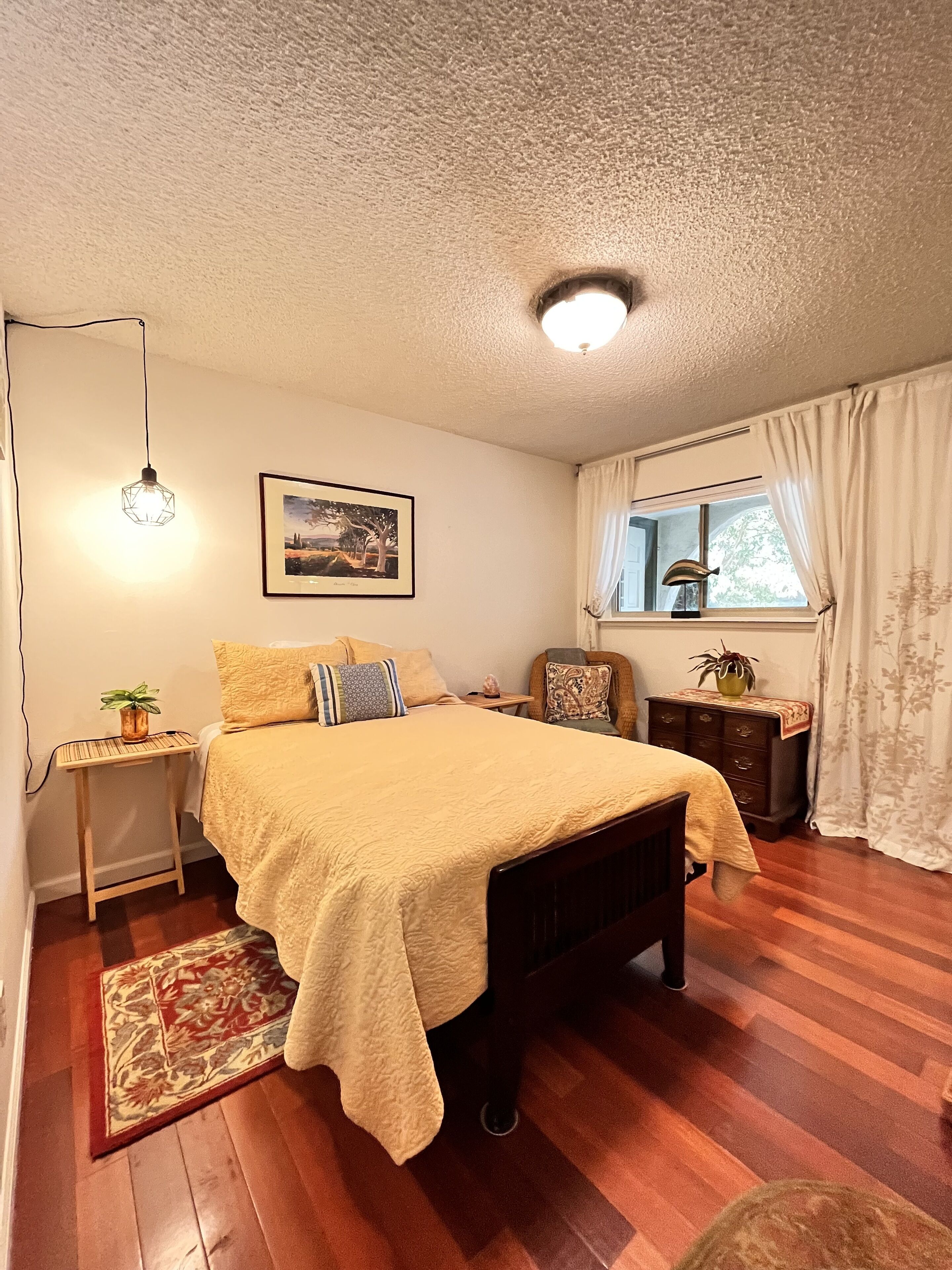 Bedroom #3 located at the fron of the house with a full bed.