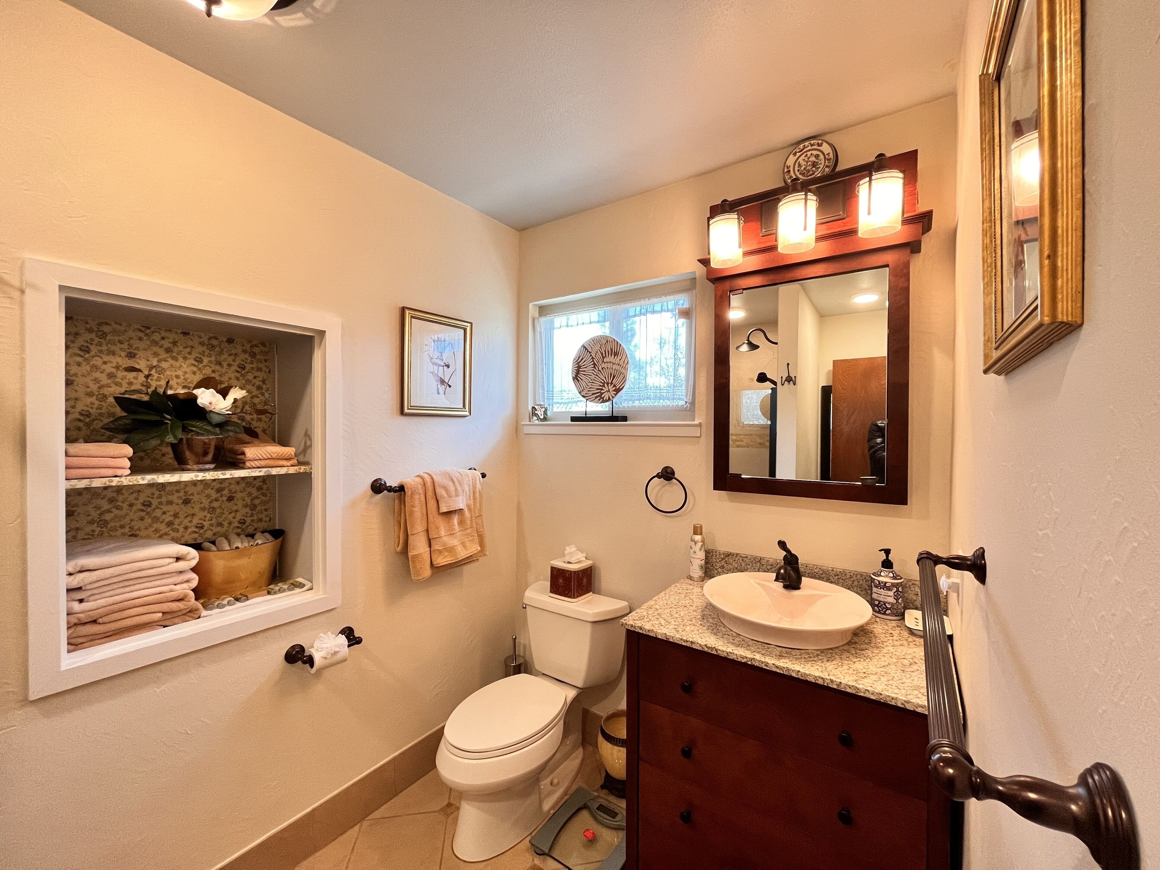Master bathroom vanity and towel storage.