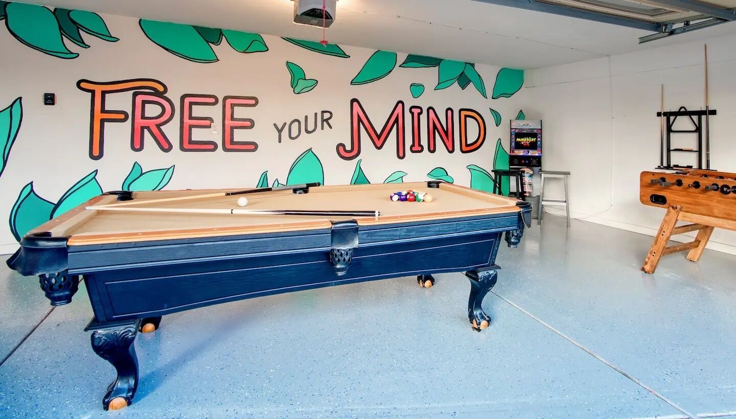 Garage game room with billiards, foosball and retro arcade with hundreds ofgames