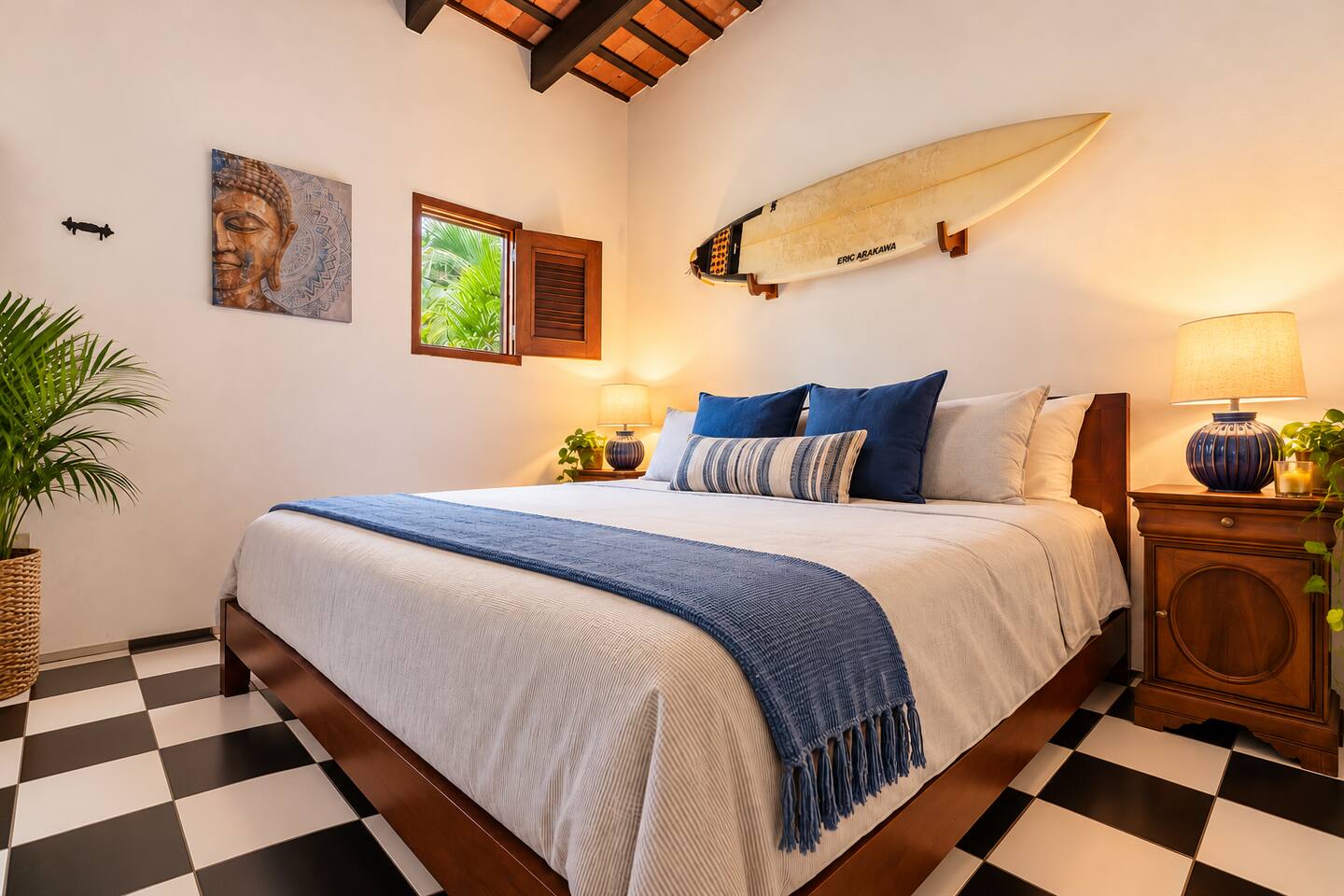 Unwind in this inviting main-level King bedroom featuring exposed wooden beams, coastal-inspired décor, & a peaceful atmosphere. Enjoy a comfortable King bed & easy access to the full bathroom—perfect for recharging after a day exploring Old San Juan