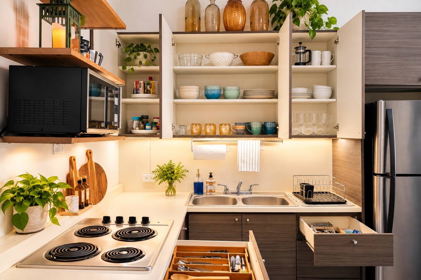 Everything you need to prepare light meals, snacks, or a leisurely breakfast! Fully stocked kitchen includes cookware, dishes, utensils, glassware, a stove top, microwave, and full-size refrigerator—perfect for enjoying meals together.