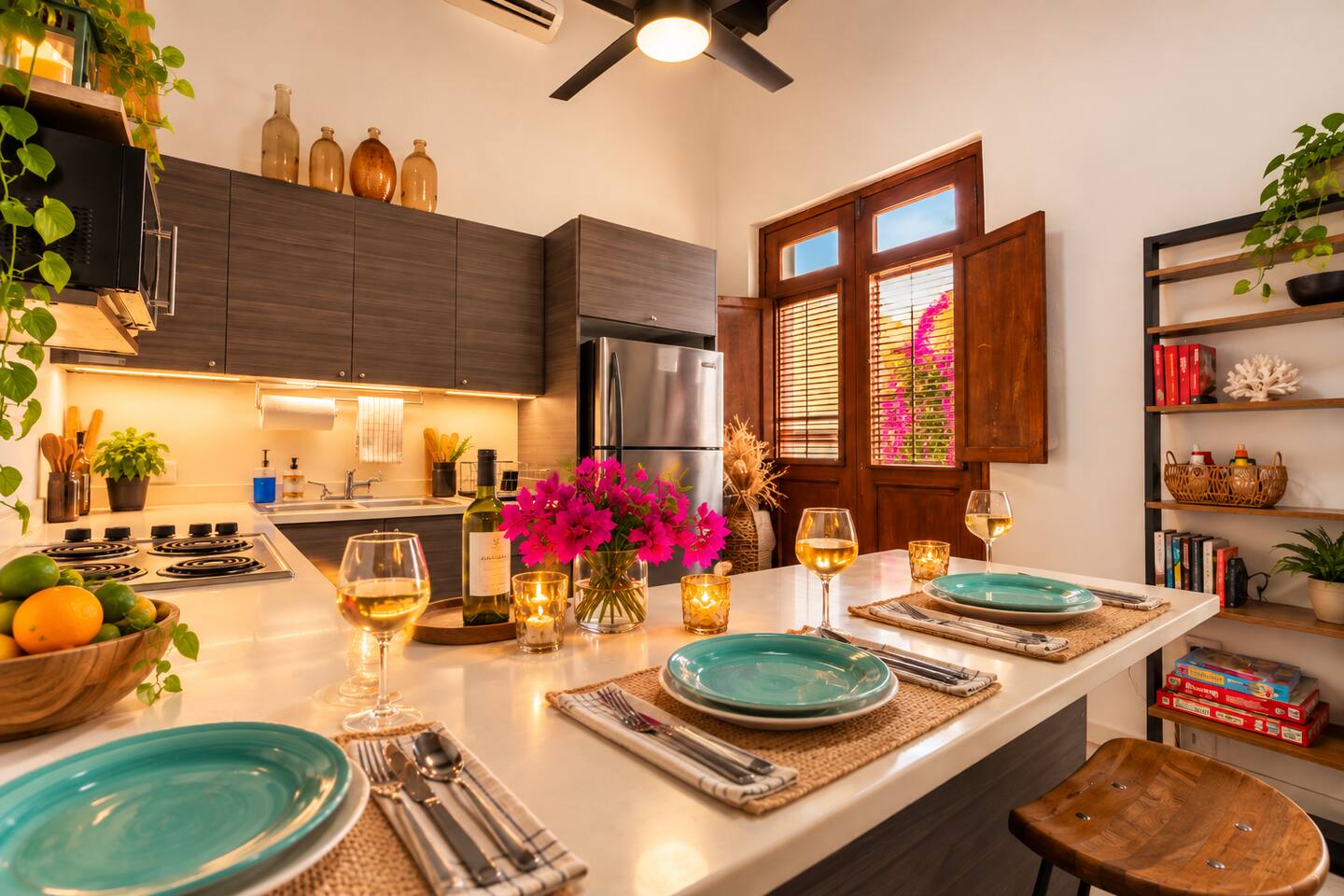 Gather around the spacious kitchen island for wine, conversation, and shared meals! This fully equipped kitchen features modern appliances, charming Colonial shutters, and seating for three—perfect for making memories with friends and family.