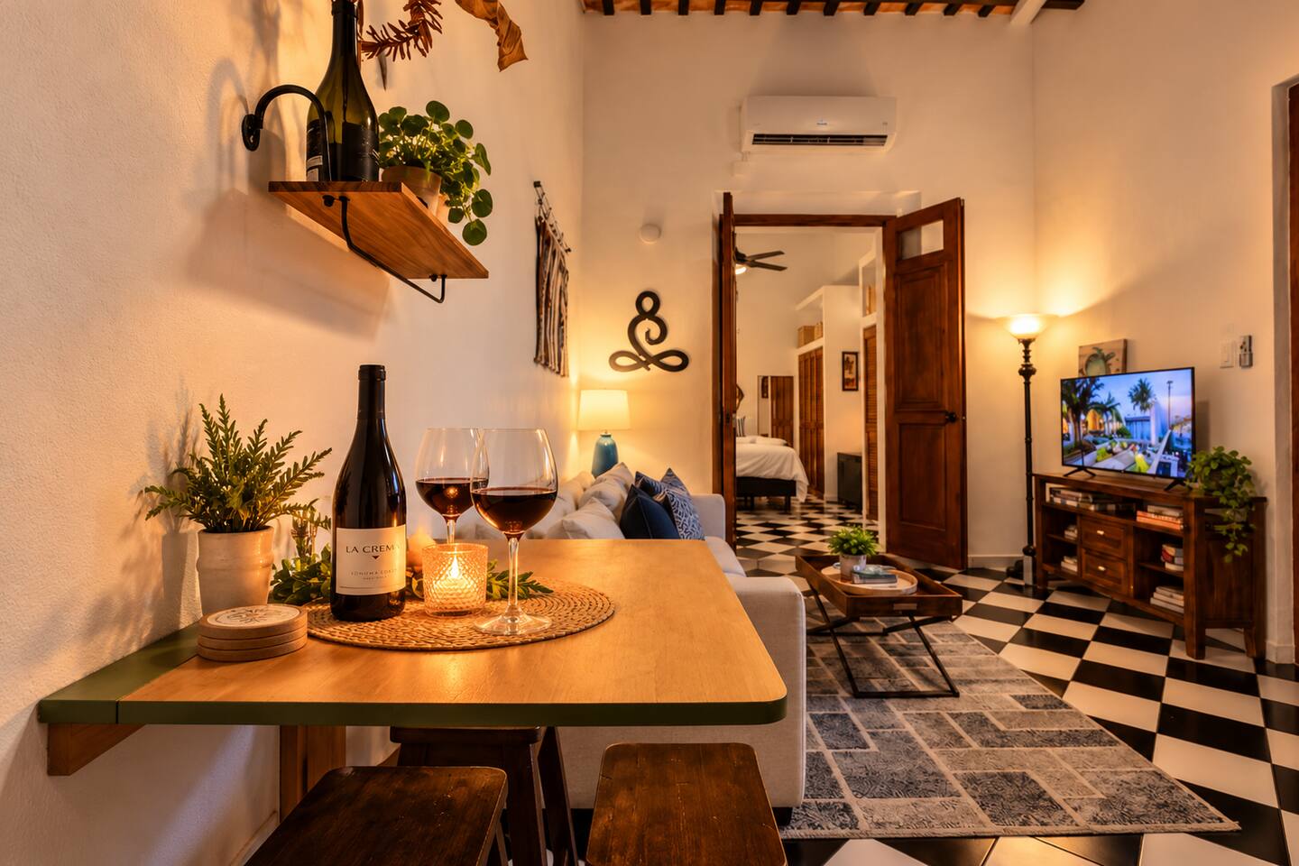 Set the mood for romance with a glass of wine by candlelight in this intimate Old San Juan retreat. Warm lighting, Spanish Colonial charm, and a cozy living area create the perfect setting to unwind together after exploring the colorful streets.