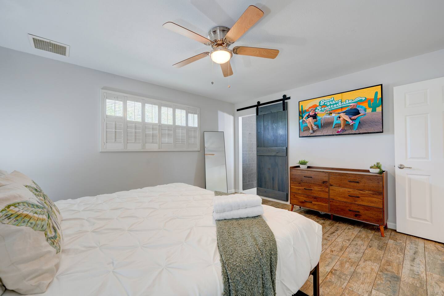 The primary suite with en suite full bath, lots of places to unpack and a 55 inch smart TV!