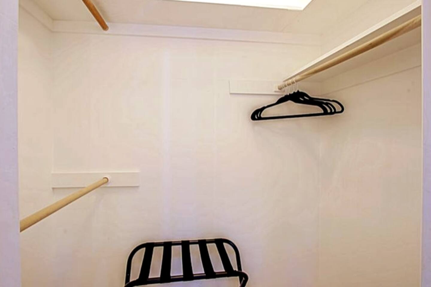 Hangers and luggage rack in every closet. This is the Primary King Room closet.