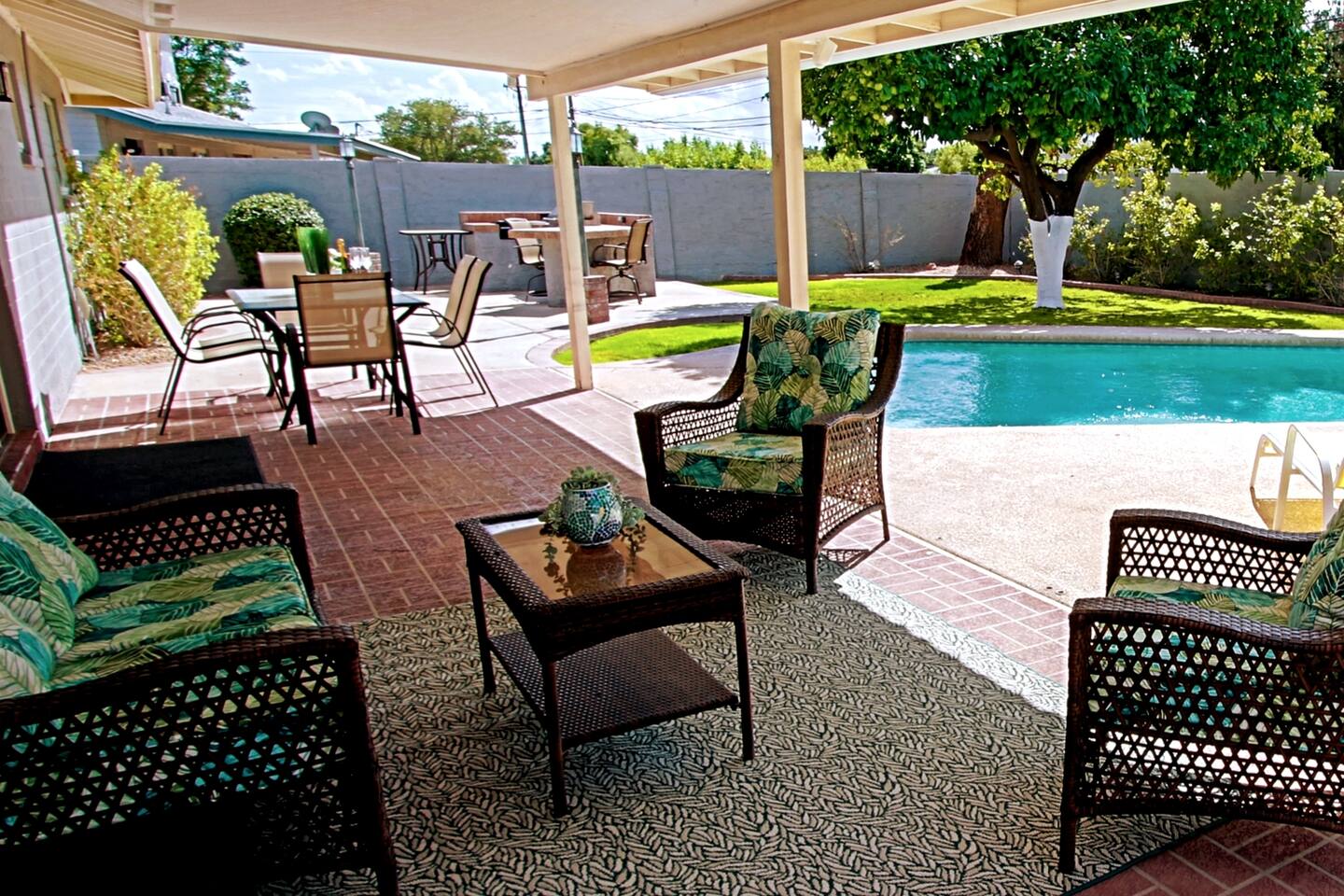 Plenty of places to chill in the shade by the sparkling blue pool. Grab a drink after your travel day and hang out!