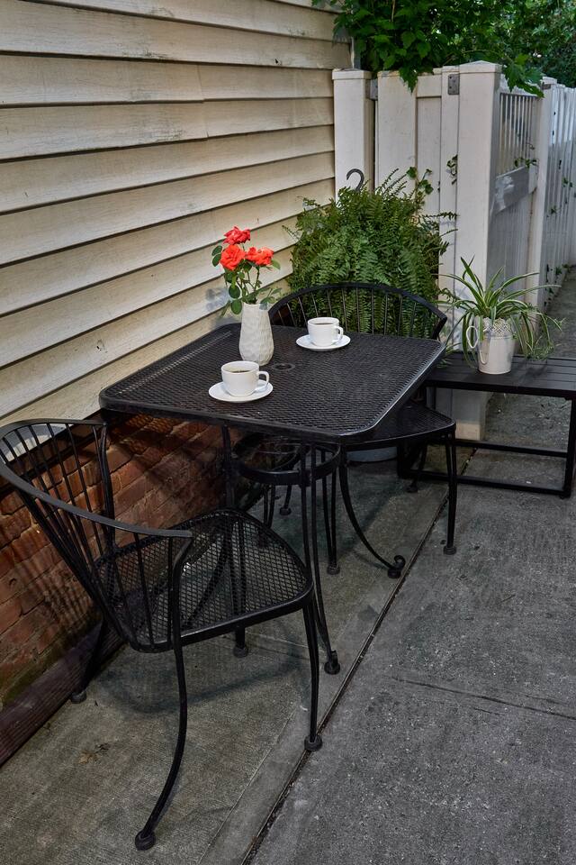 Nice table on side of home to enjoy your morning coffee