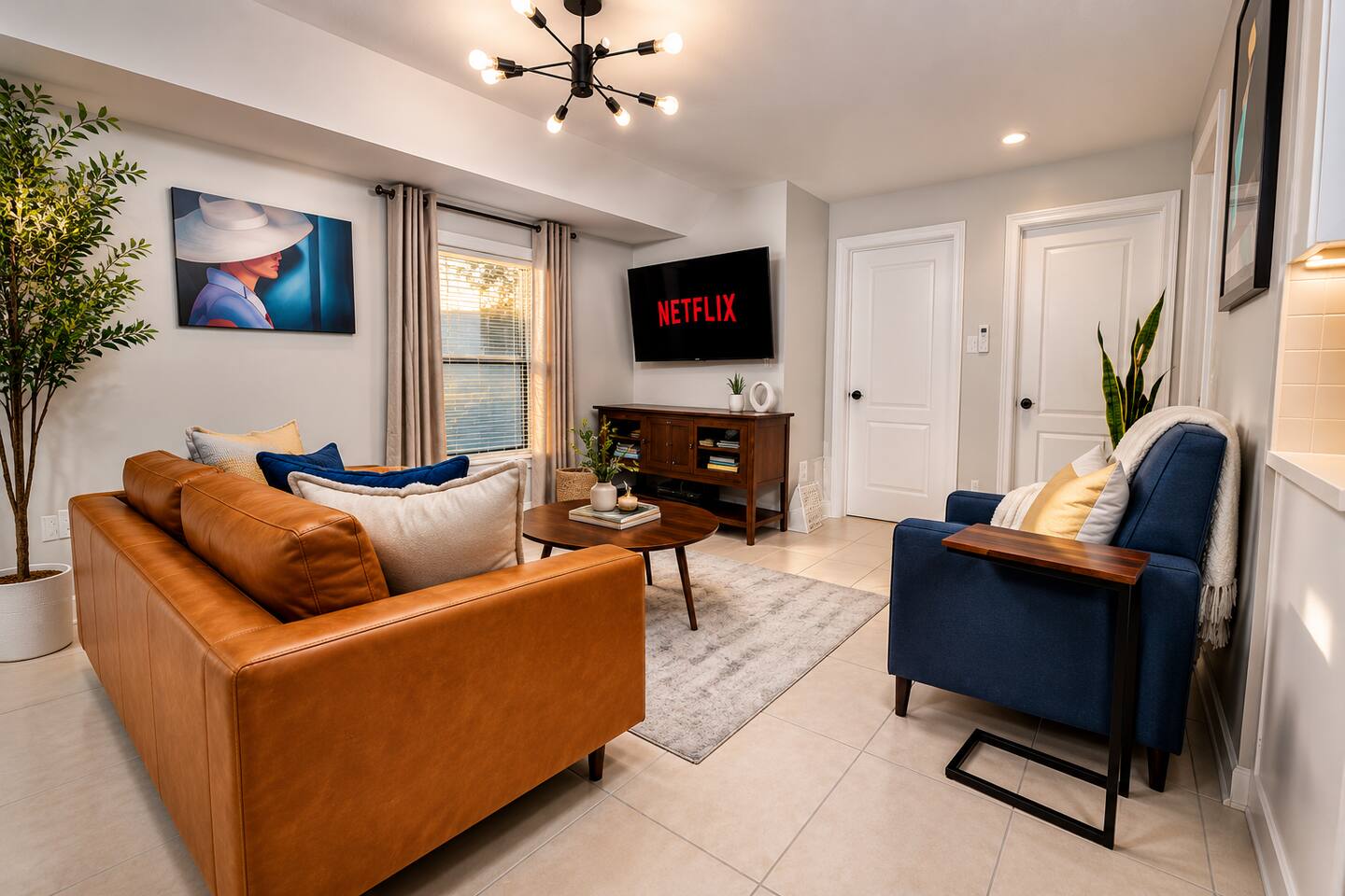 Relax in comfort in the living room. 

Read a book, watch a movie, or play some board games with your loved ones. 

Features:
- leather sofa
- reclining seat
- side end tables
- coffee table
- two ottomans