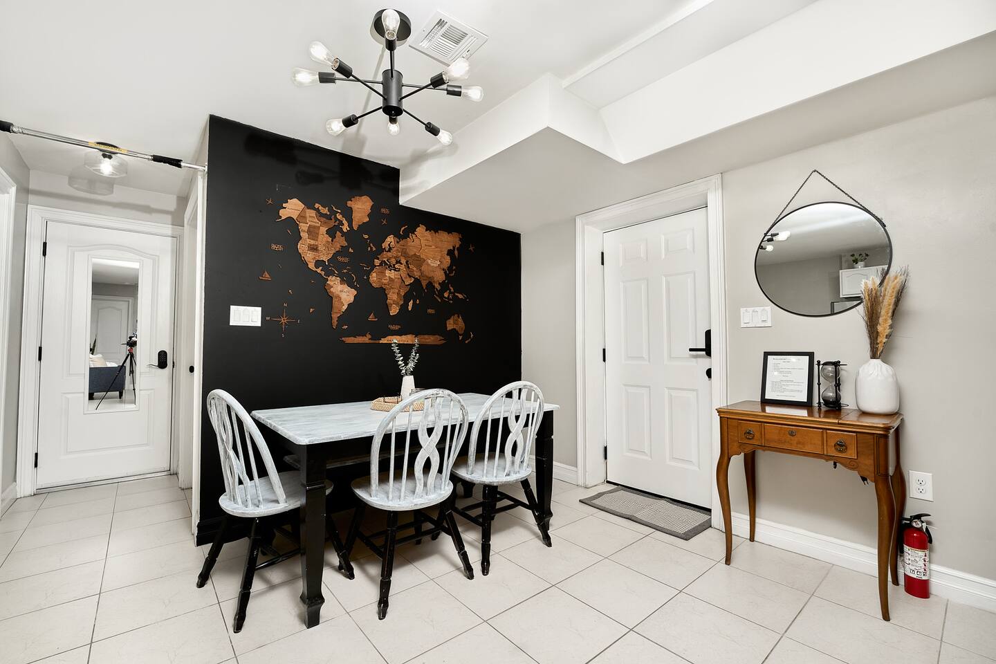 Delight in warm family meals on your dining table.

Space also showcases custom world map from artist, Enjoy the Wood!