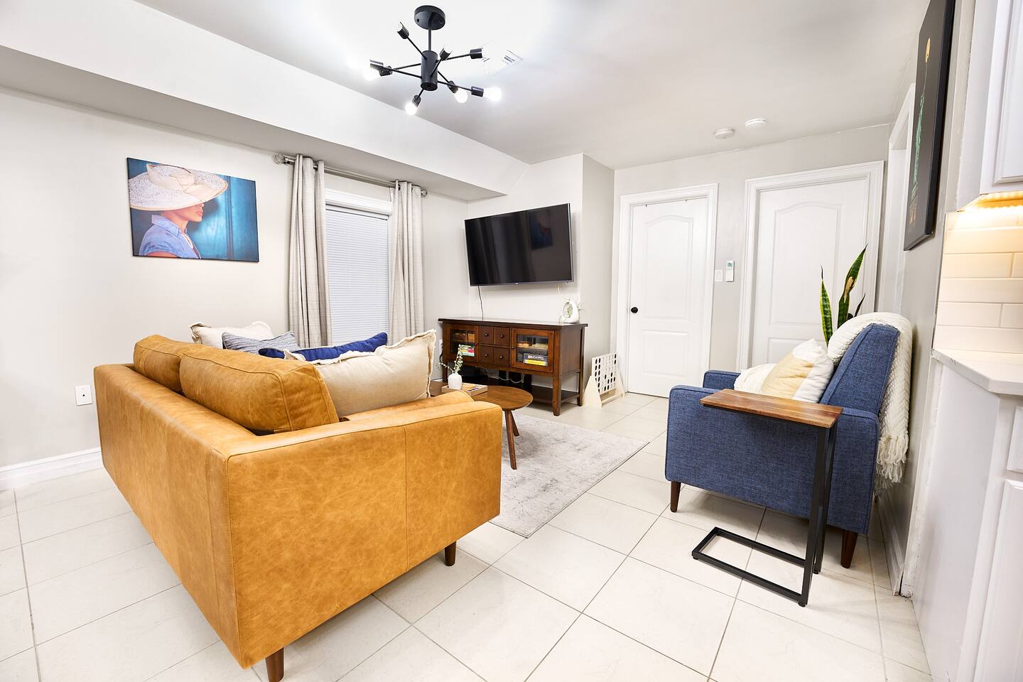 Relax in comfort in the living room. 

Read a book, watch a movie, or play some board games with your loved ones. 

Features:
- leather sofa
- reclining seat
- side end tables
- coffee table
- two ottomans